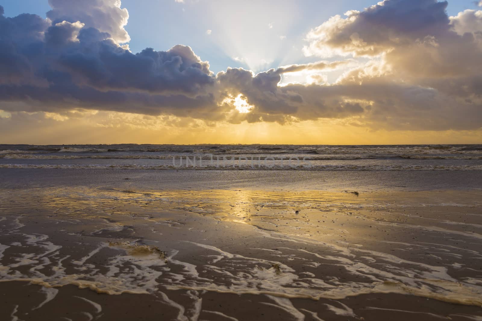 sunset at he north sea at the touristic village of rockanje in holland