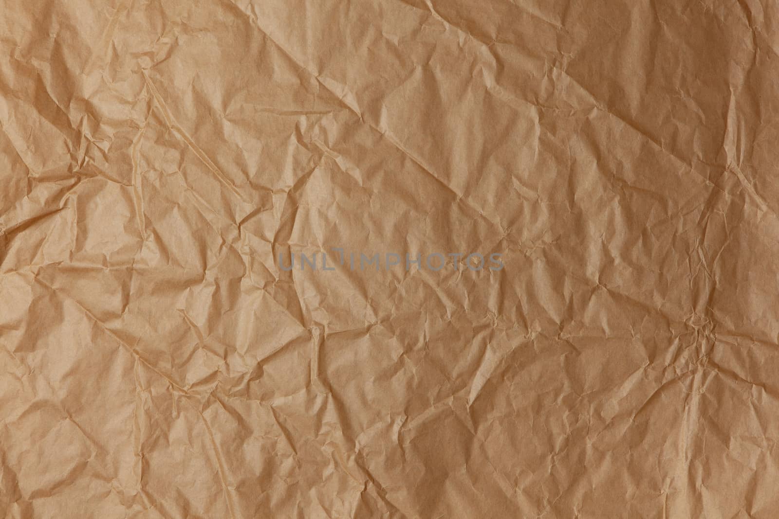 Abstract texture. Crumpled craft brown paper background. Copy space for text. Horizontal. DIY, handicraft, back to school, ecology, plastic free concept, harvesting for mock up. Flat lay, top view.