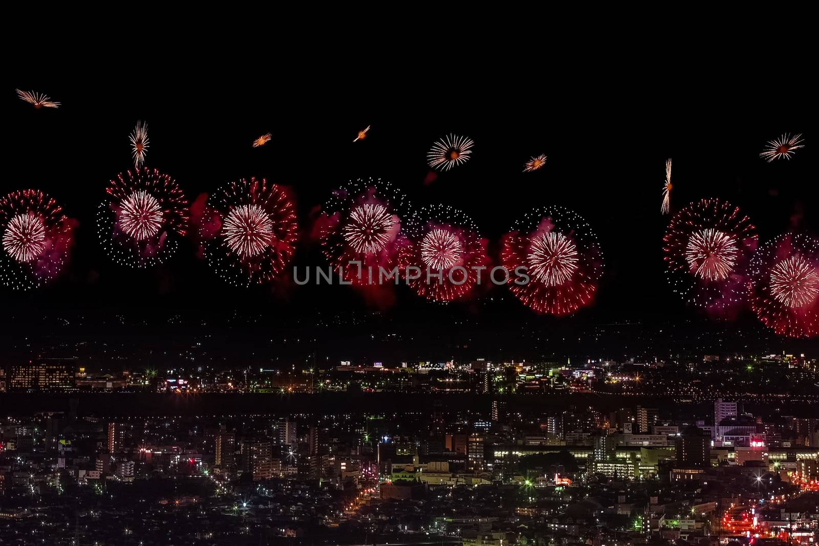 Festive salute in the night sky. Salute over the city the megalopolis. Explosions of fireworks.