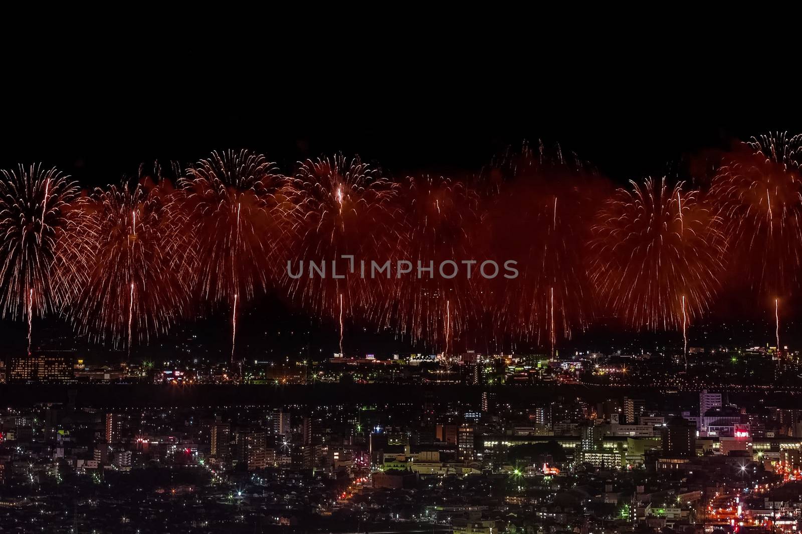 Salute over the city the megalopolis. Festive salute in the nigh by nyrok