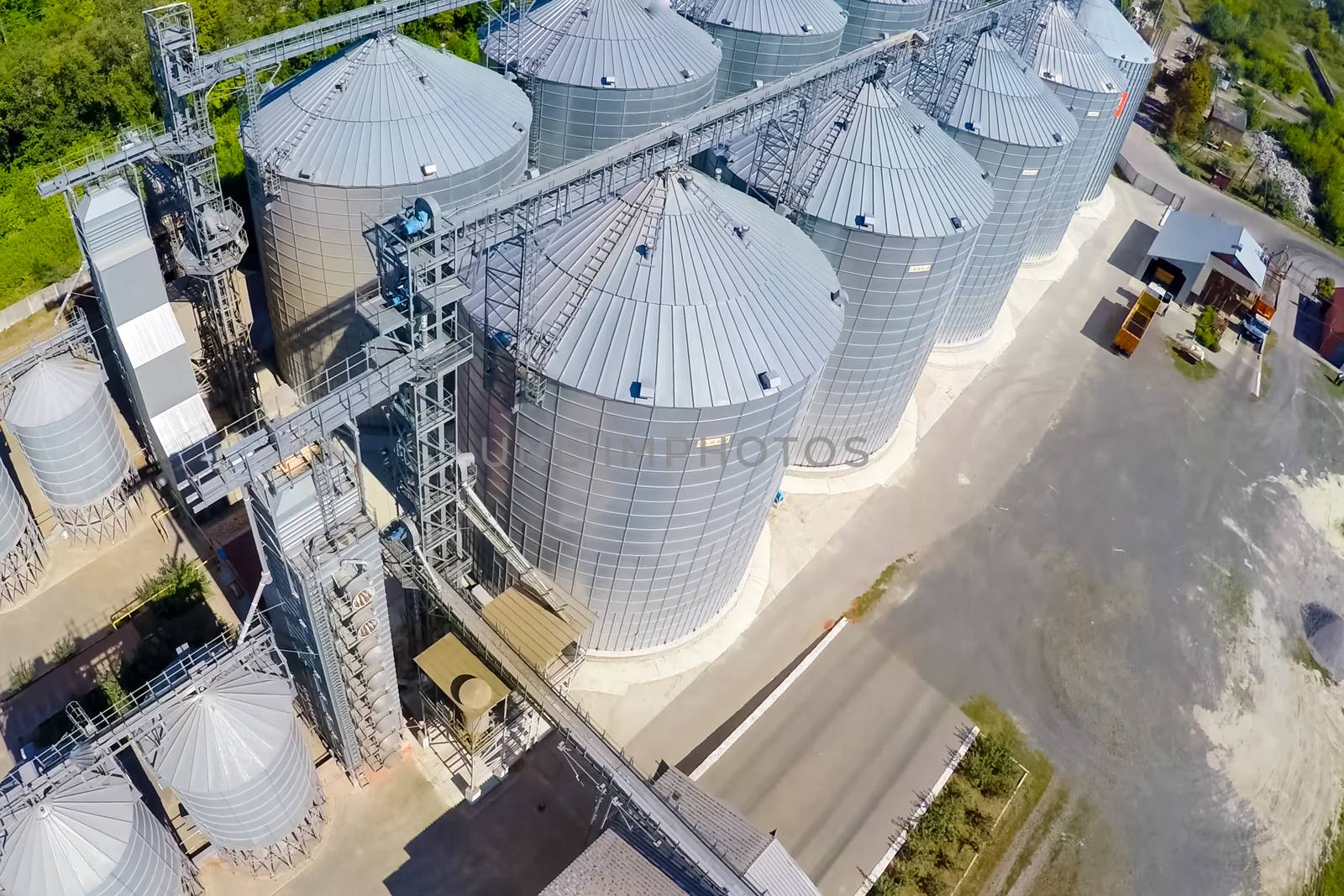 Flight of the grain terminal from the drone. The grain plant for storage and drying of grain. Grain terminal. Plant for the drying and storage Rice plant in the middle of fields by nyrok