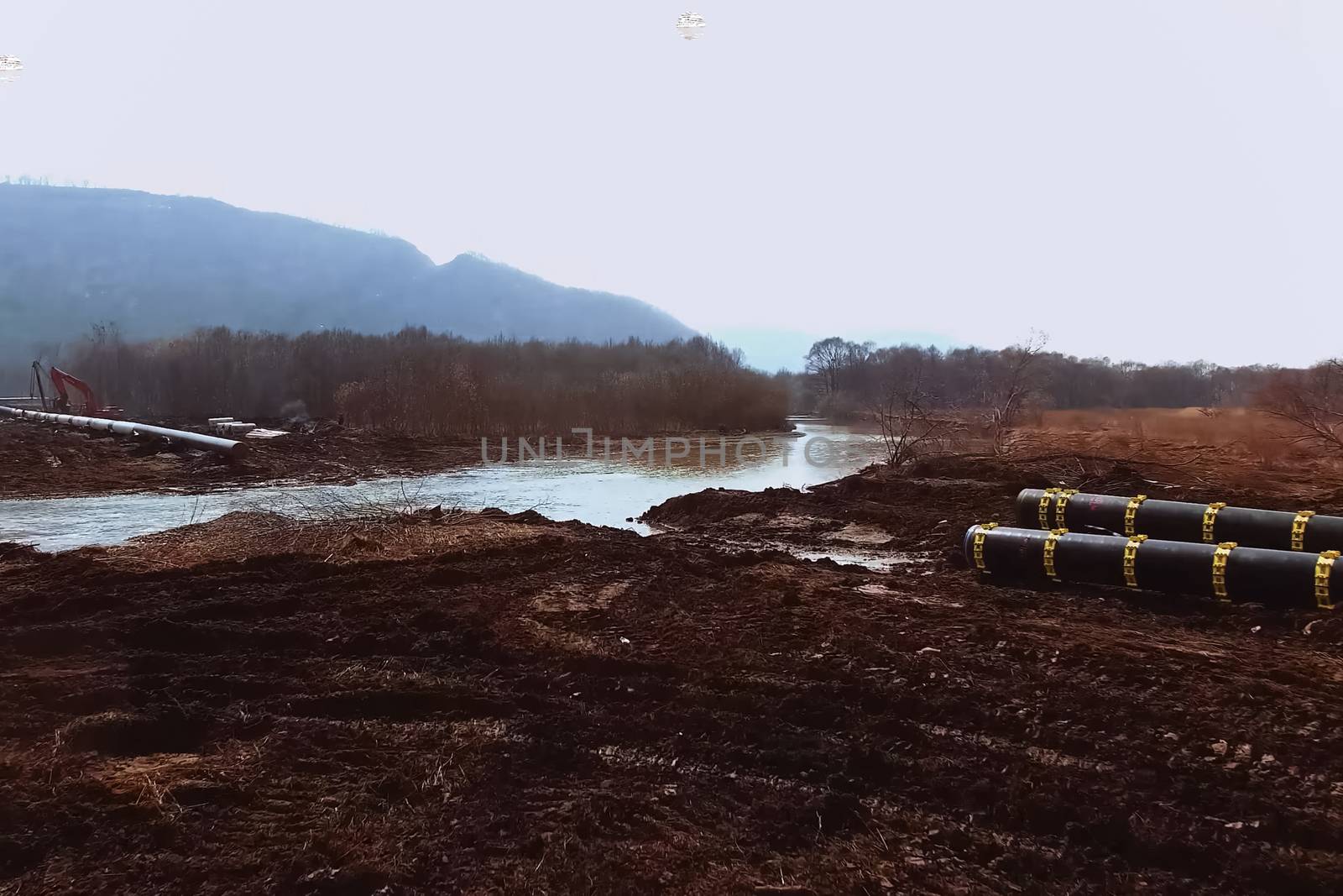 Construction of a pipeline across the river. Difficulties in laying pipelines. Pipes of a gas pipeline, construction and laying of pipelines for transportation of gas and oil.
