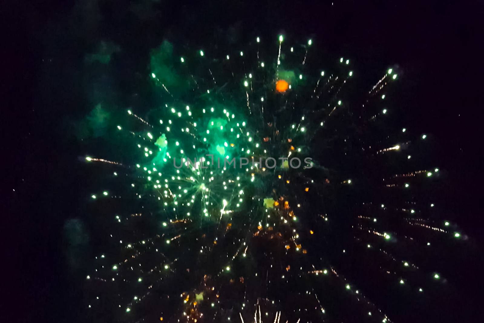 Festive salute in the night sky. Explosions of fireworks.