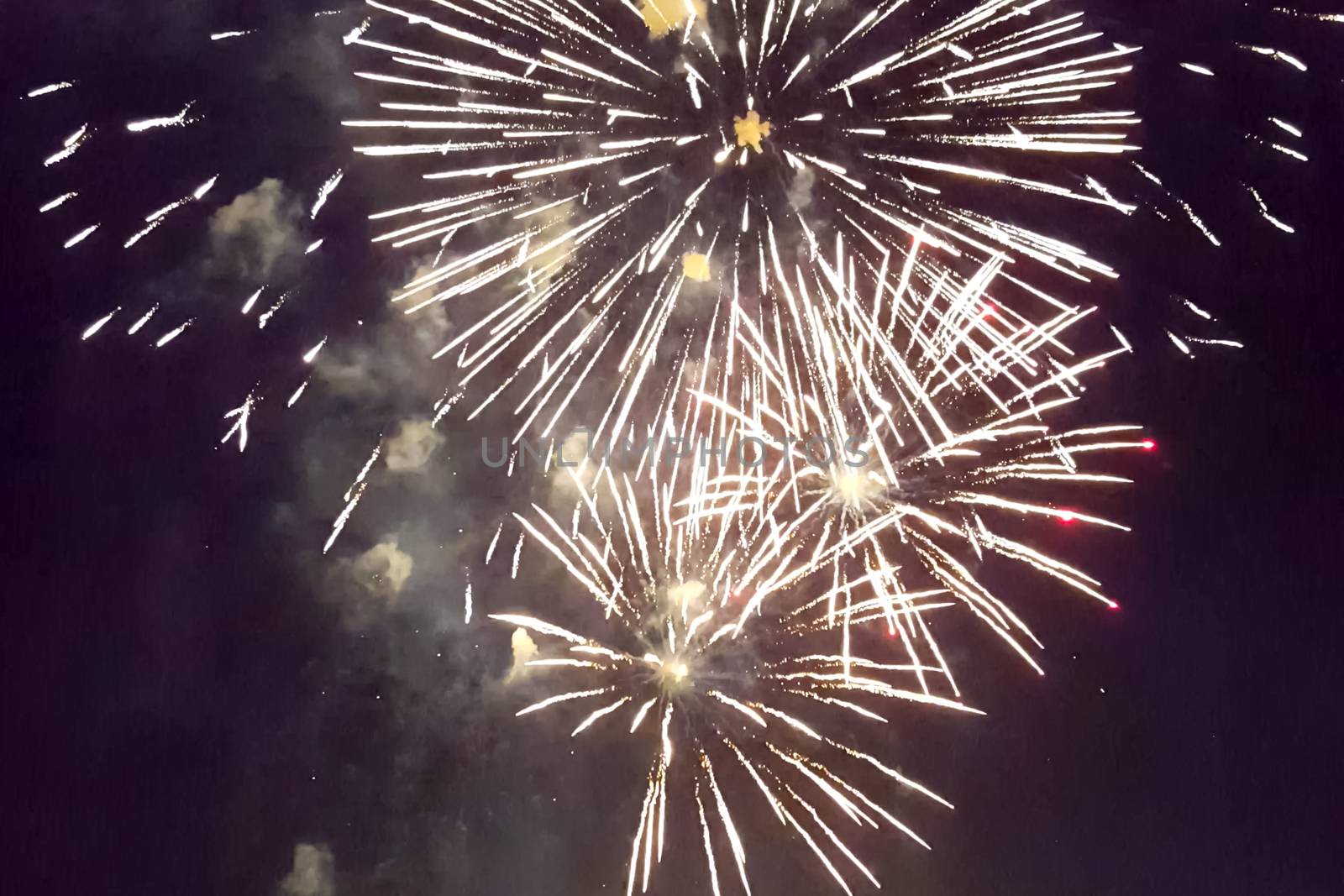 Festive salute in the night sky. Explosions of fireworks.