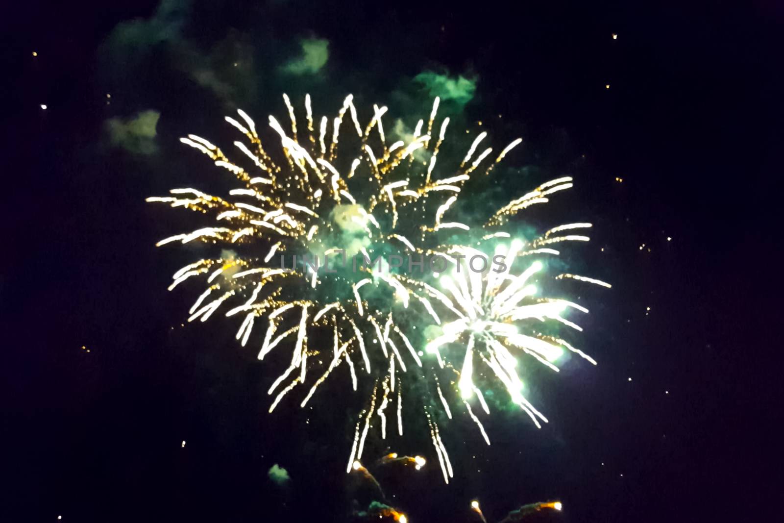 Festive salute in the night sky. Explosions of fireworks.