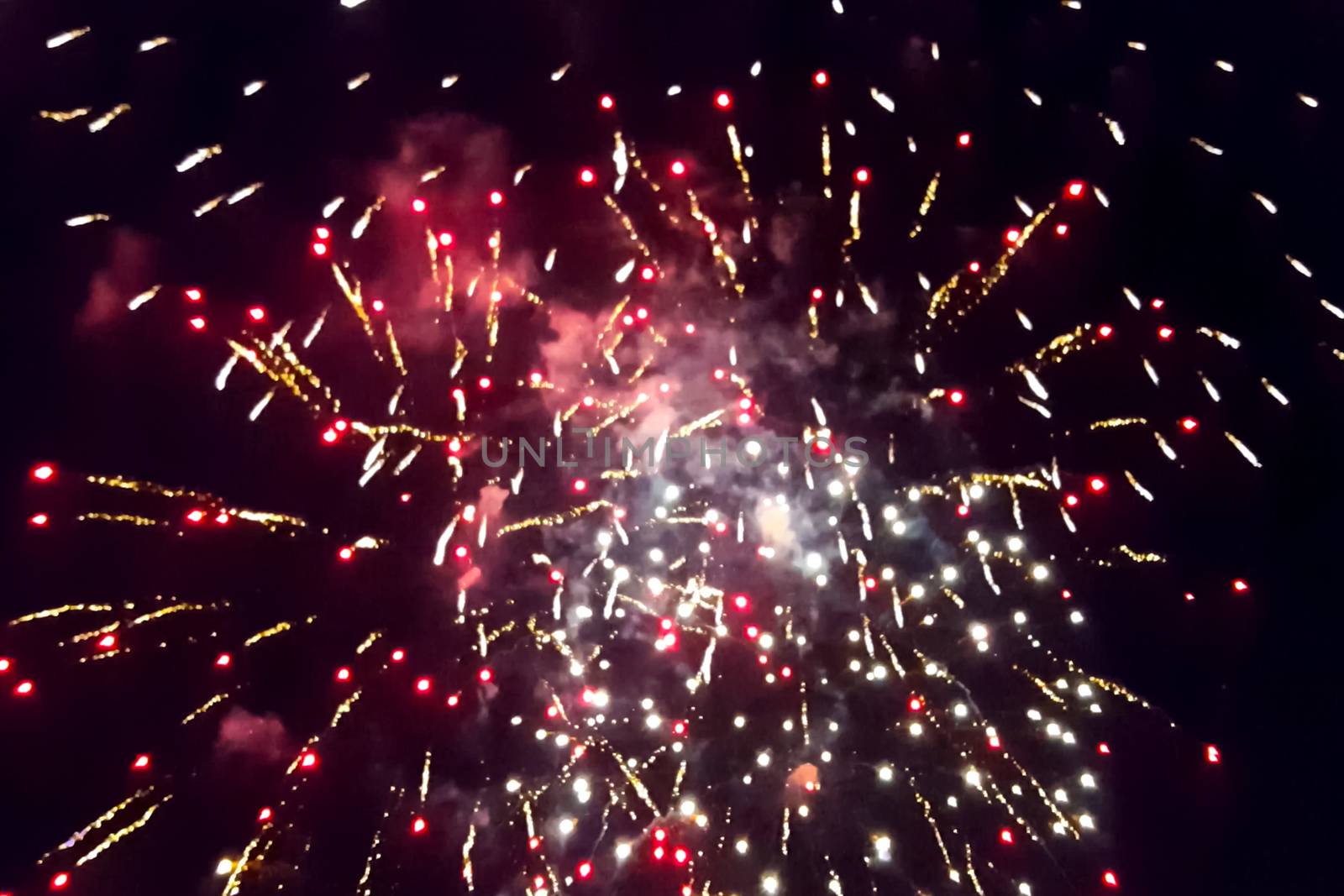 Festive salute in the night sky. Explosions of fireworks.