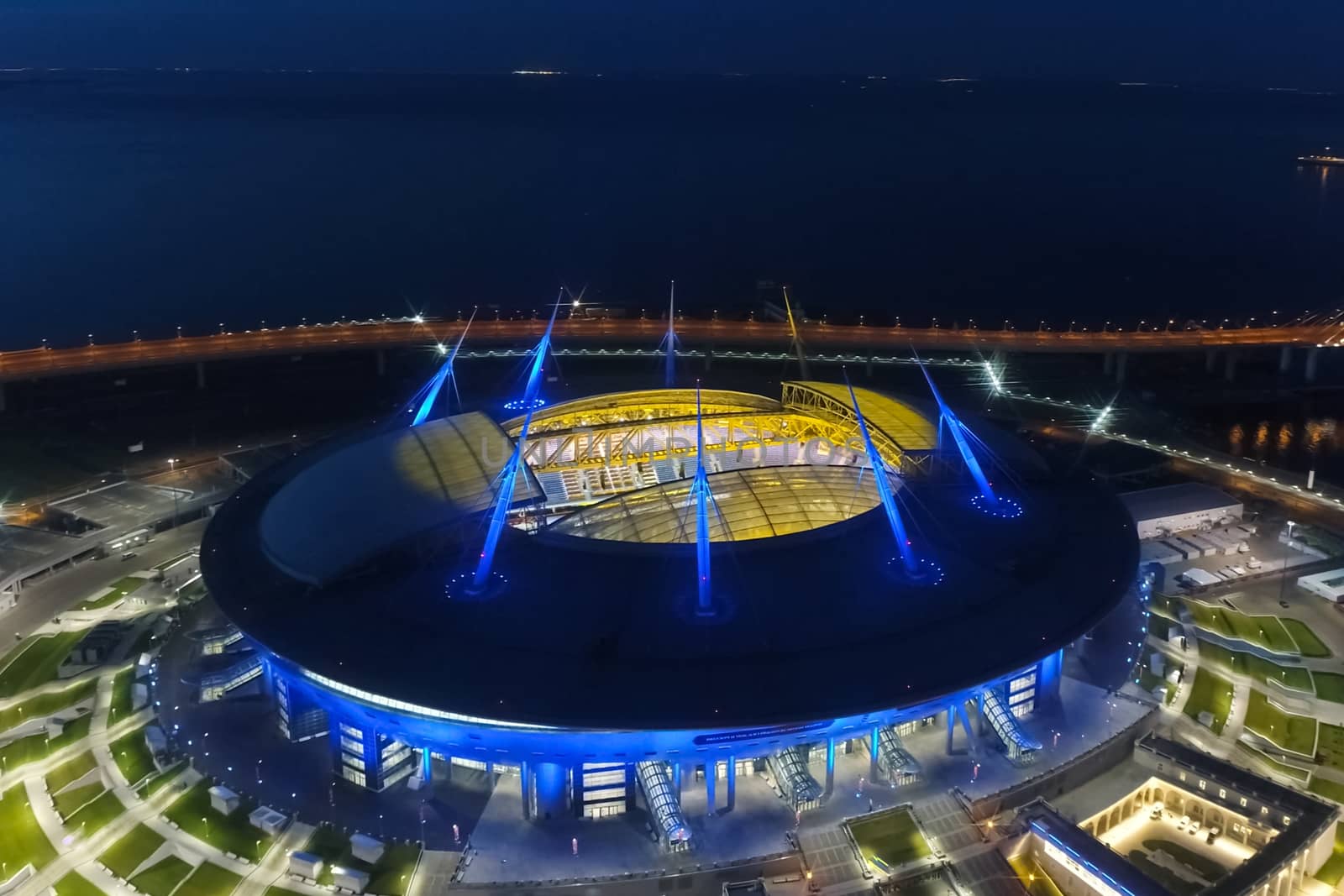 Stadium Zenith Arena at night. Illuminated by multi-colored lights the stadium at night. by nyrok
