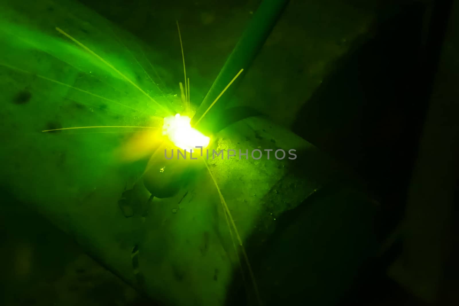 Metal pipe during welding. Sparks and scale by nyrok