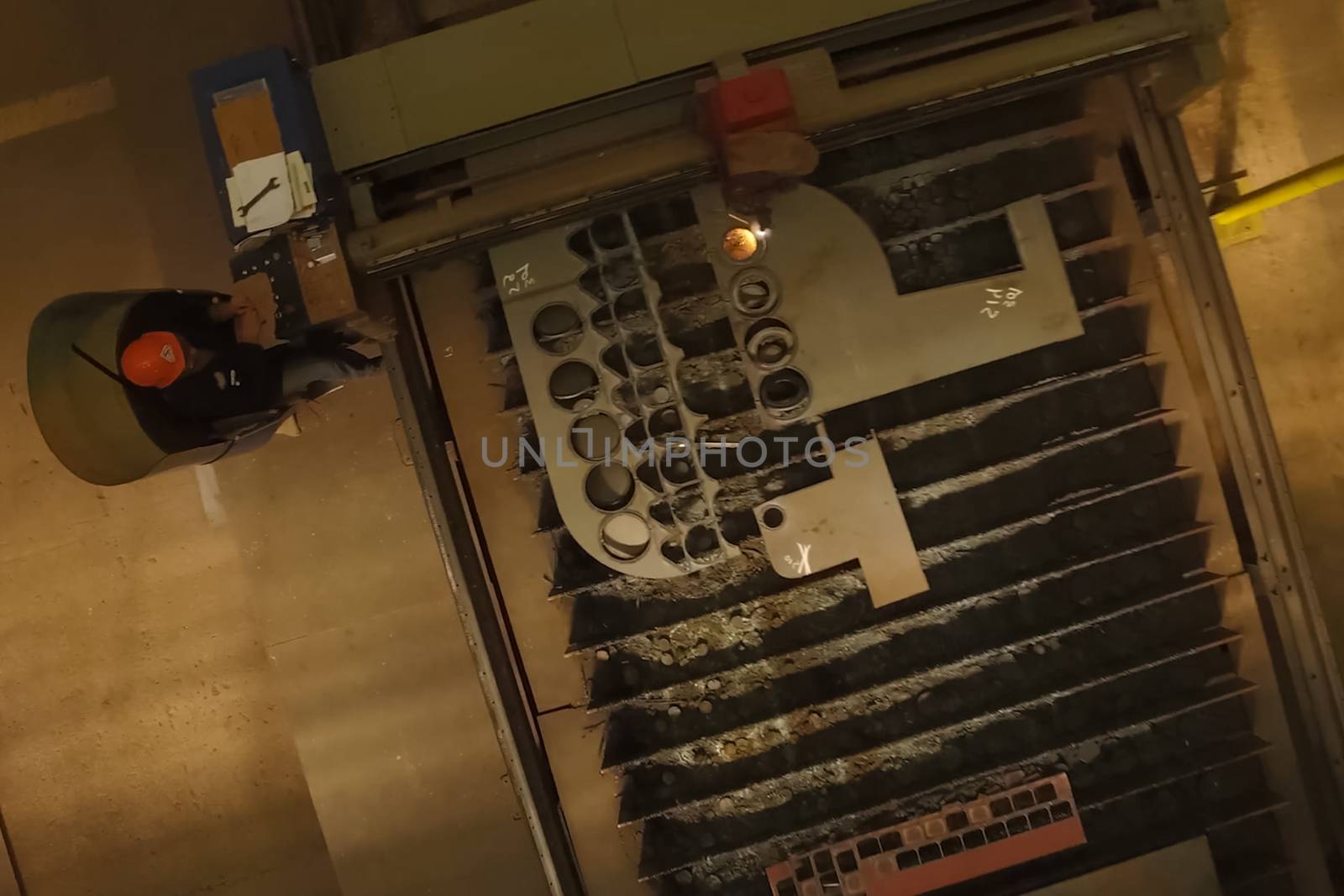 The worker welds the parts with welding. view from above.