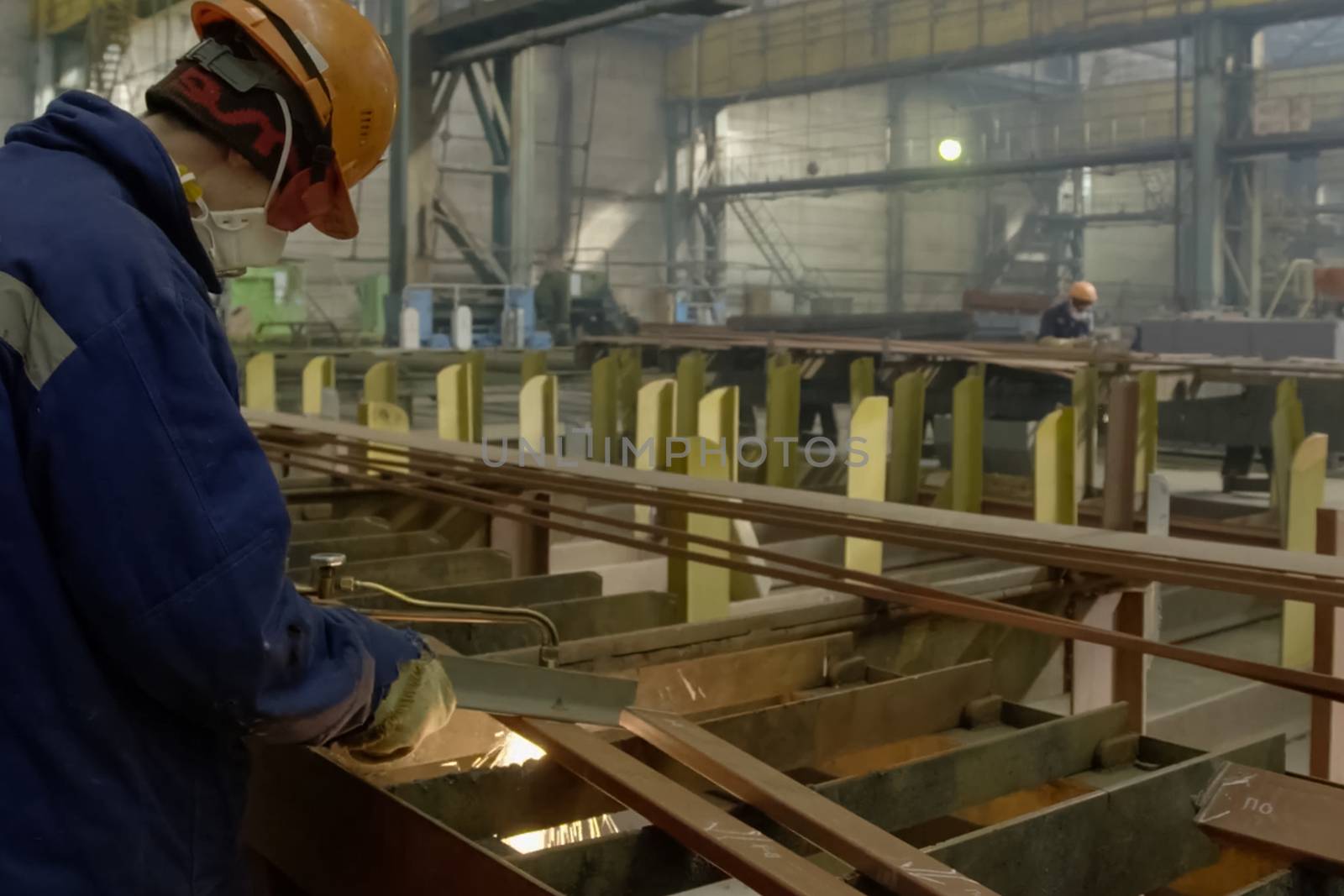 Novorossiysk, Russia - May 26, 2018: Shipbuilding plant, The welder cuts the metal with gas welding.