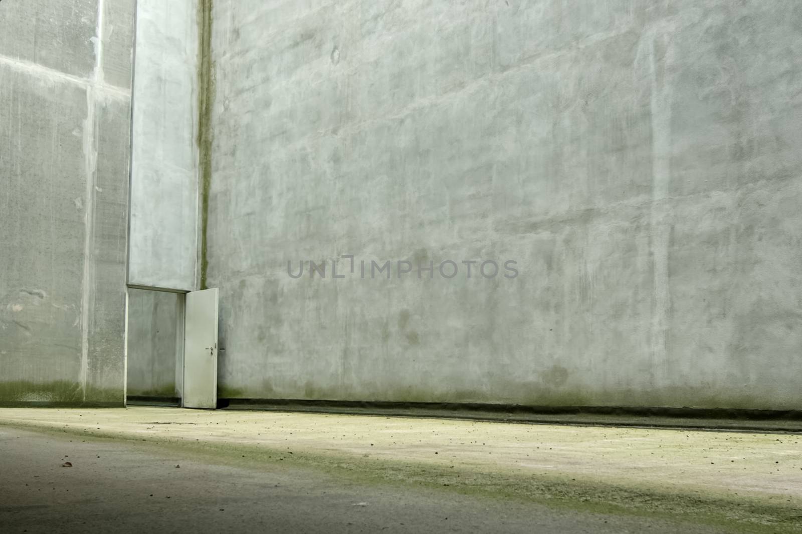 Concrete walls with large open doors in the corner. Urban urban concept.