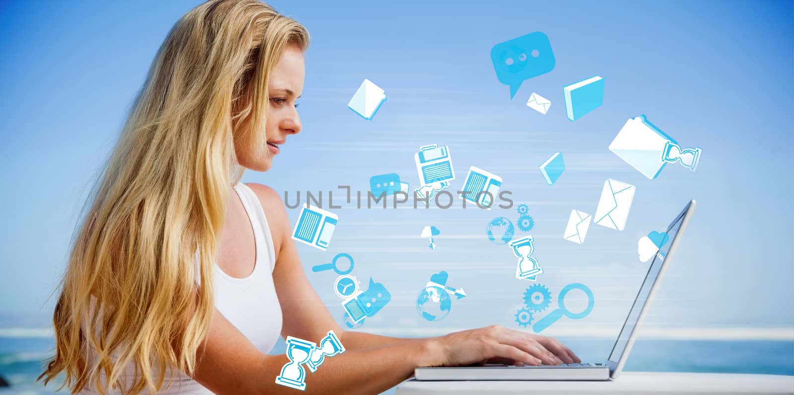 Composite image of pretty blonde using her laptop at the beach against app icons