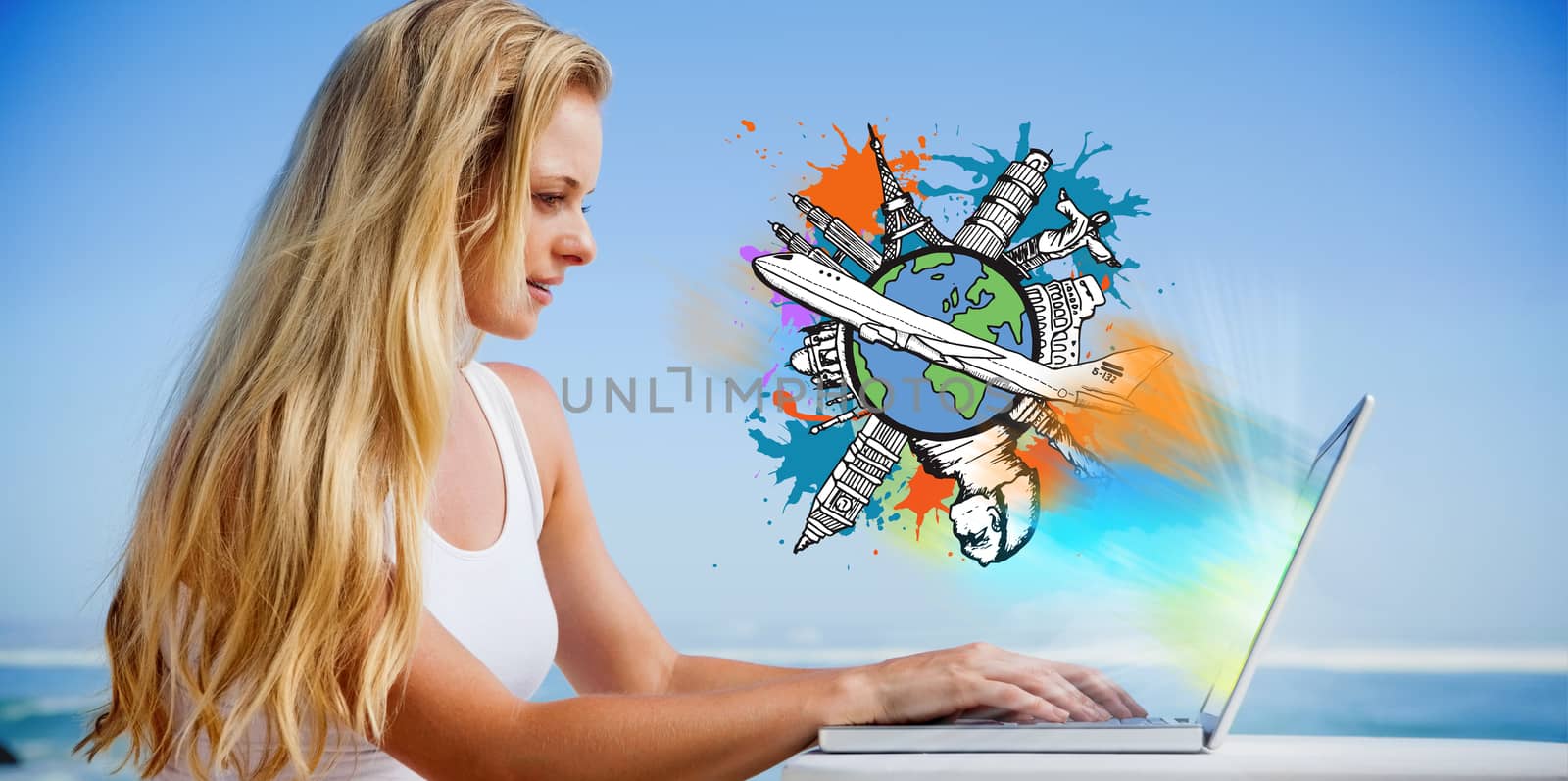 Pretty blonde using her laptop at the beach against global tourism concept on paint splashes