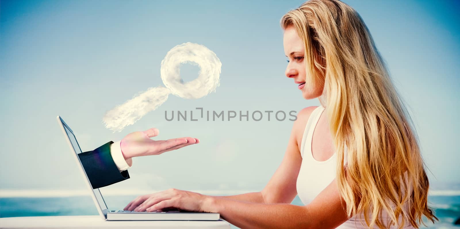 Composite image of pretty blonde using her laptop at the beach with hand presenting cloud magnifying glass