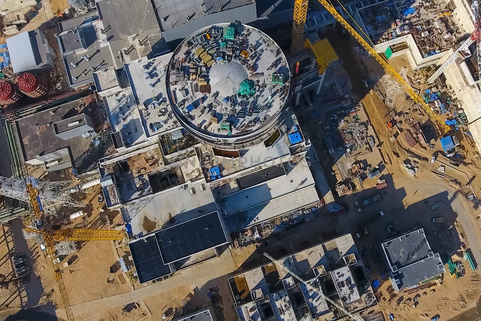 Aerial survey of a nuclear power plant under construction. Installation and construction of a power plant. Nuclear power.