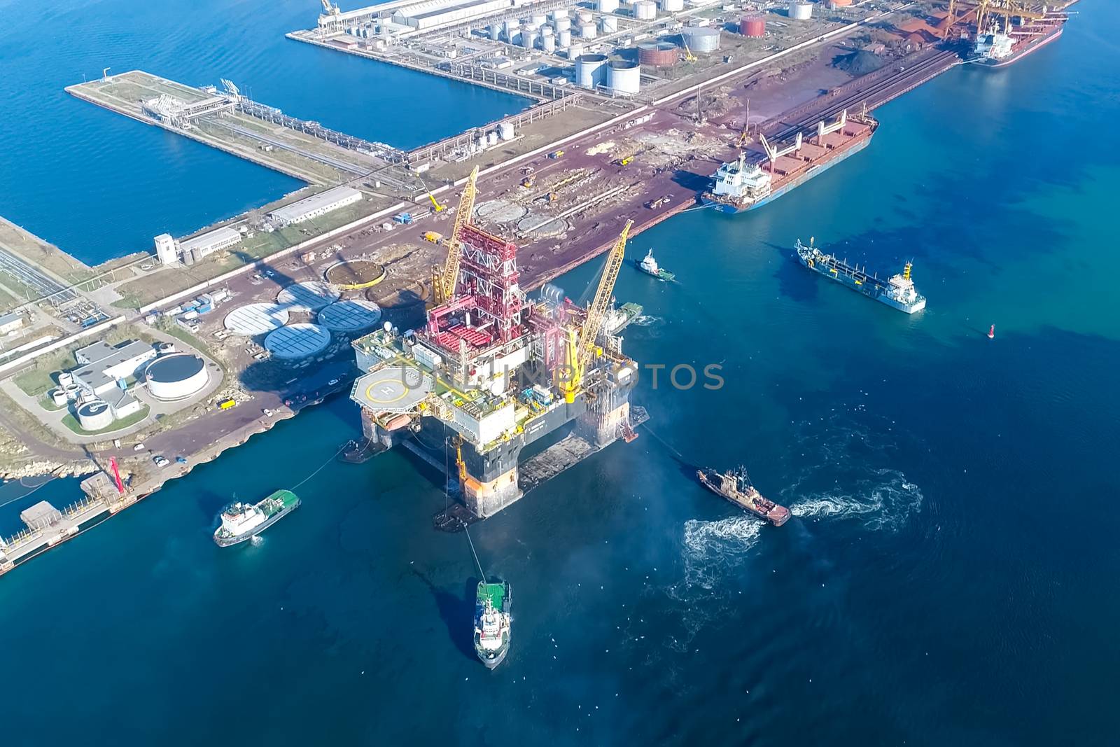 Drilling platform in the port. Towing of the oil platform.