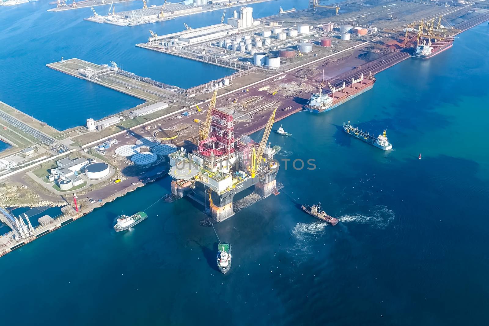 Drilling platform in the port. Towing of the oil platform.