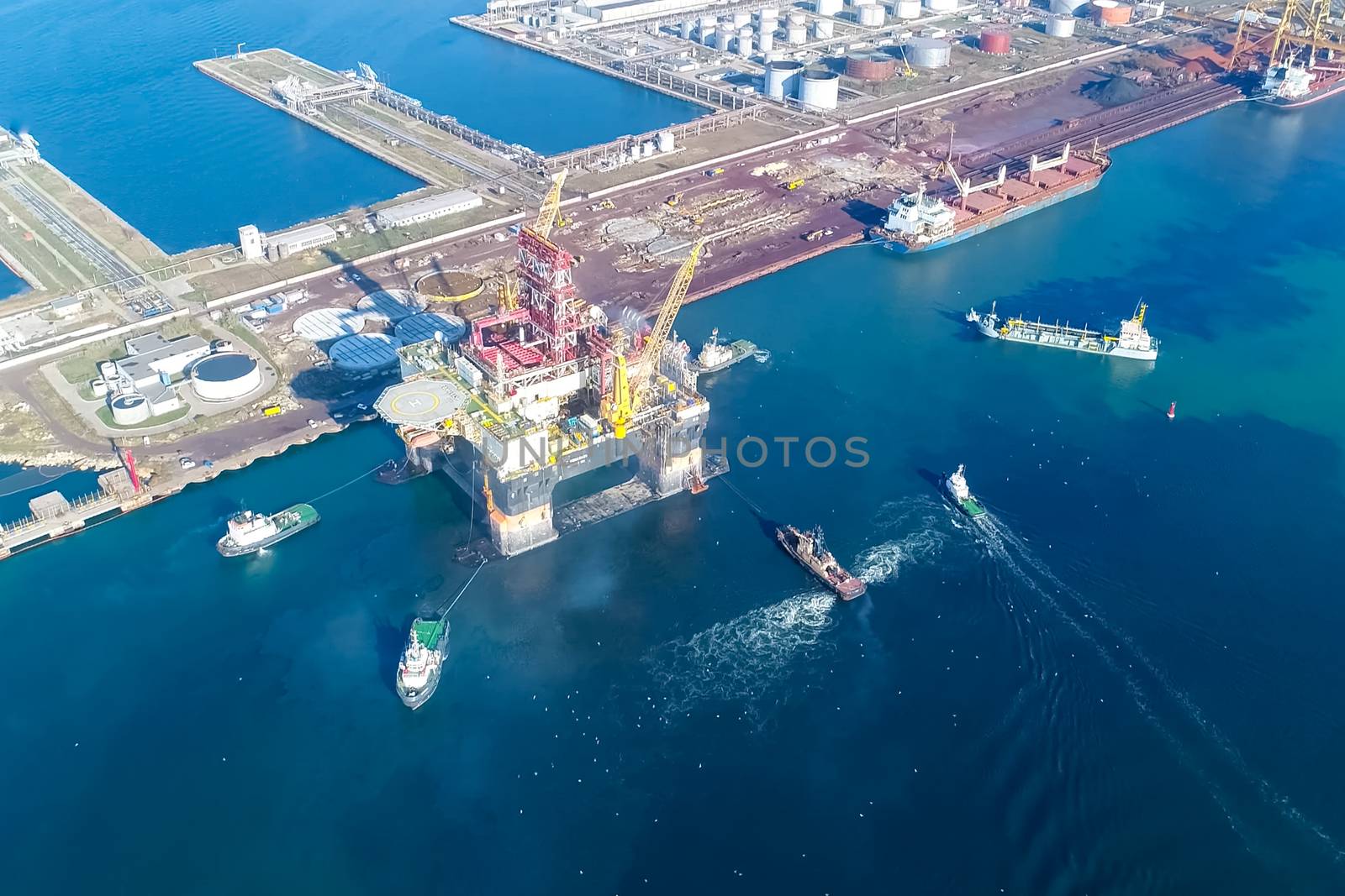 Drilling platform in the port. Towing of the oil platform.