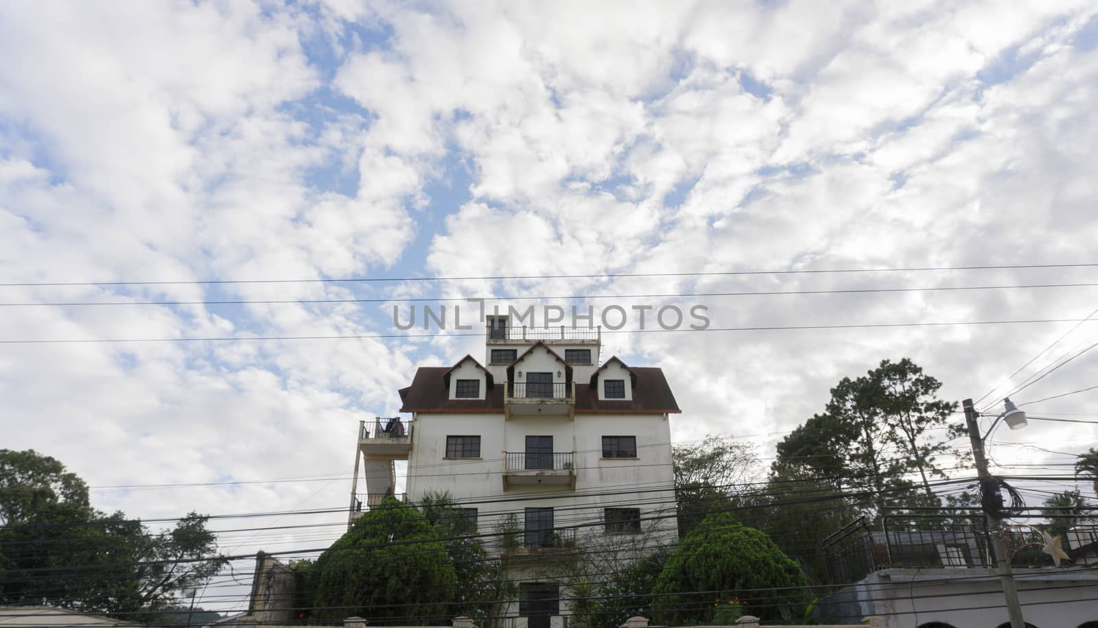 Beautiful house with a lot of clouds and blue sky