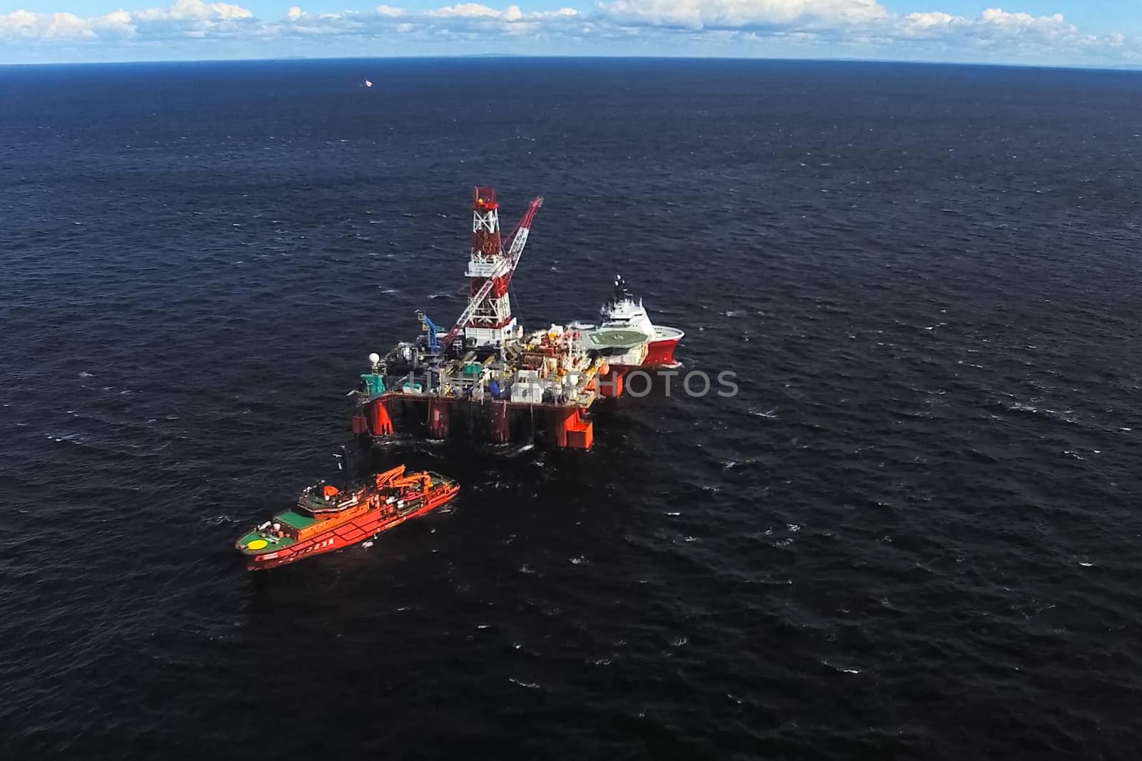 Oil offshore platform in the sea. Extraction of oil on the shelf.