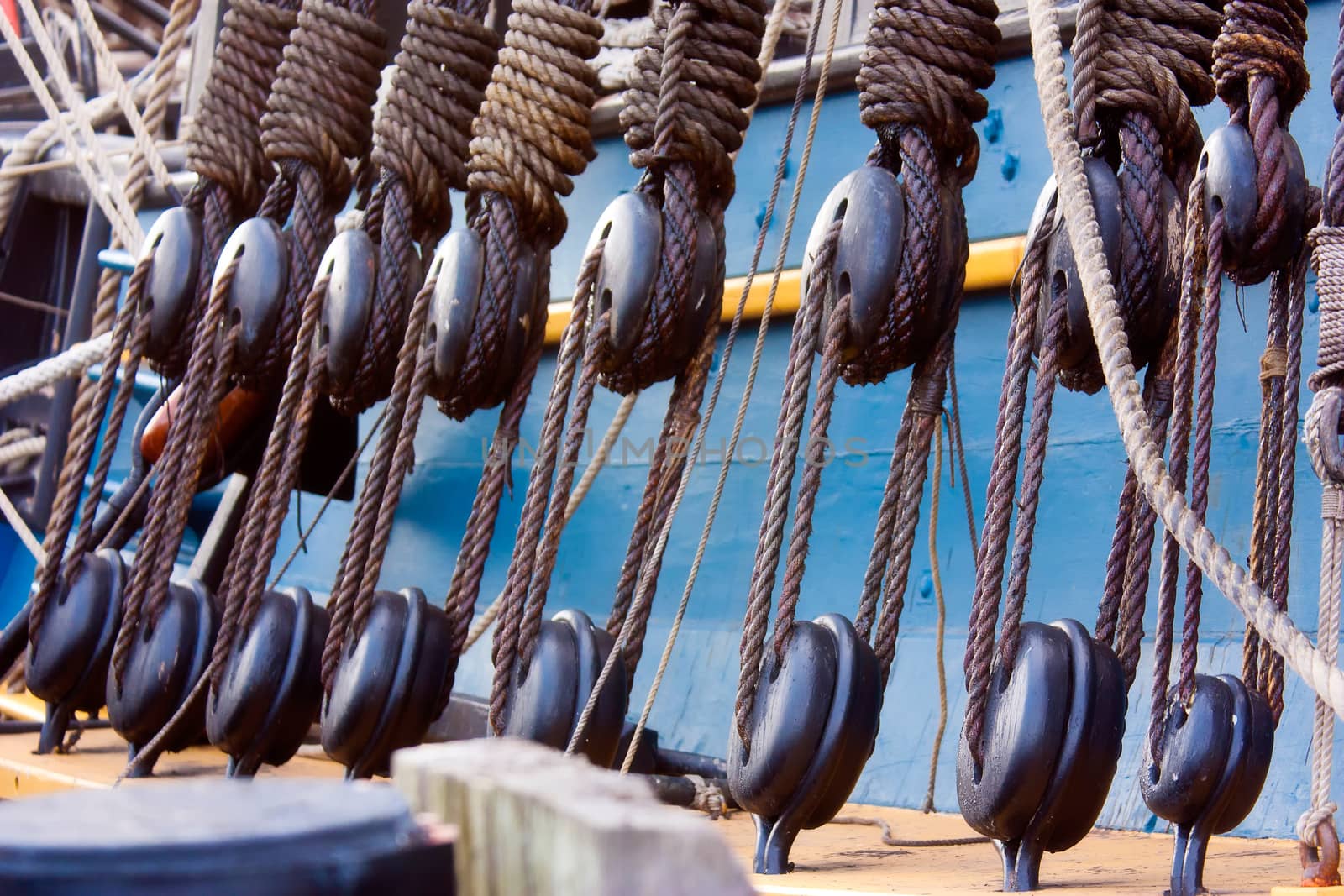 Close up shot of pulley blocks and rigging on an old sailing ship