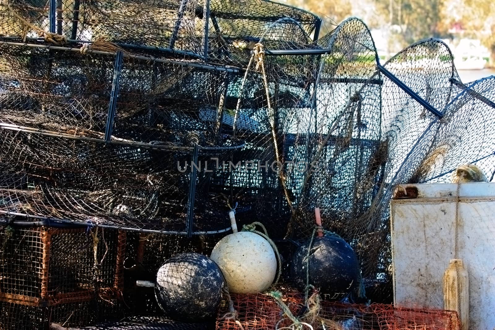 Close up shot of nets, fish traps and apparatus of professional fisherman on the shore