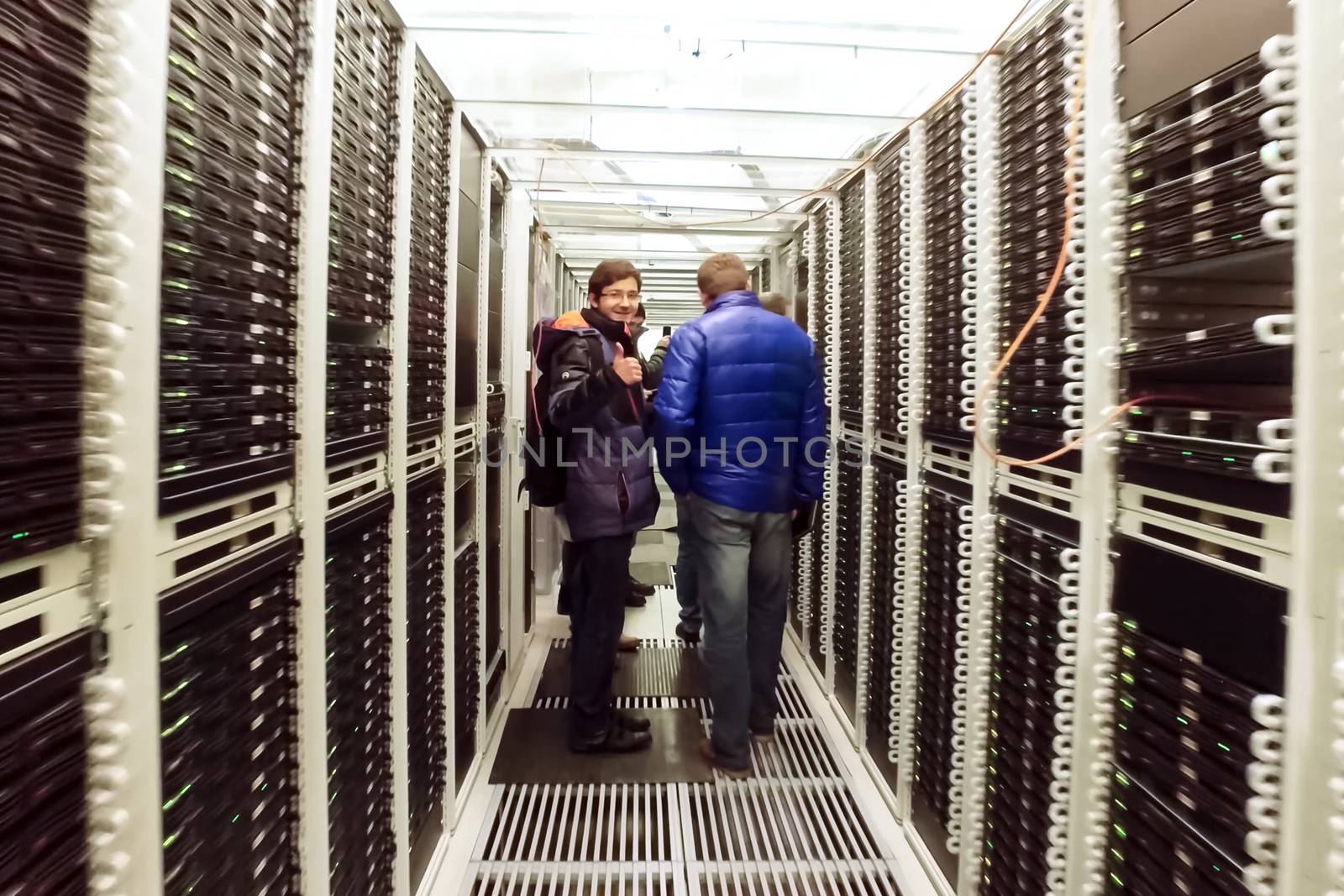 Arkhangelsk, Russia - December 27, 2017: System administrators in the corridor are the data center.