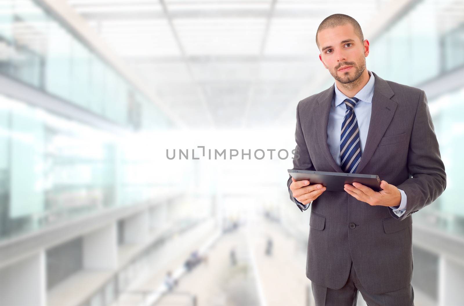 worried businessman with a tablet pc, at the office