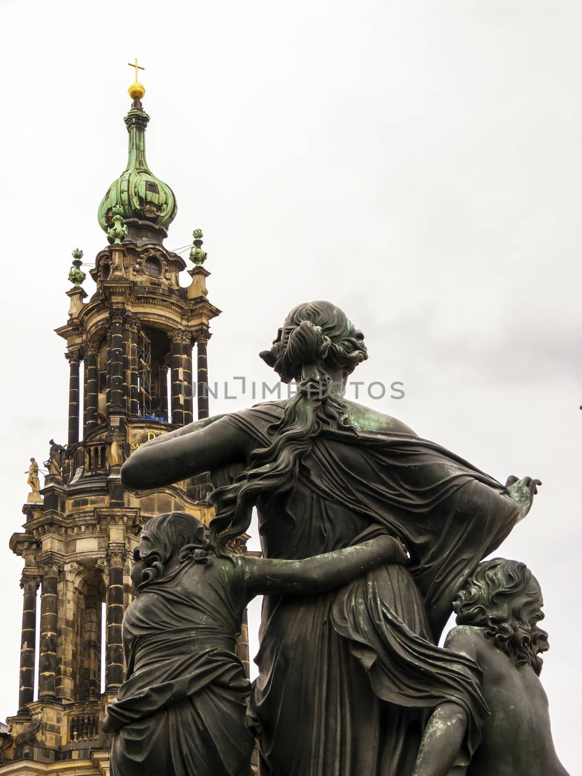 Statue in front of the bell tower of the Dresden Cathedral, the Cathedral of the Holy Trinity, the Catholic Church of the Royal Court of Saxony. Germany.