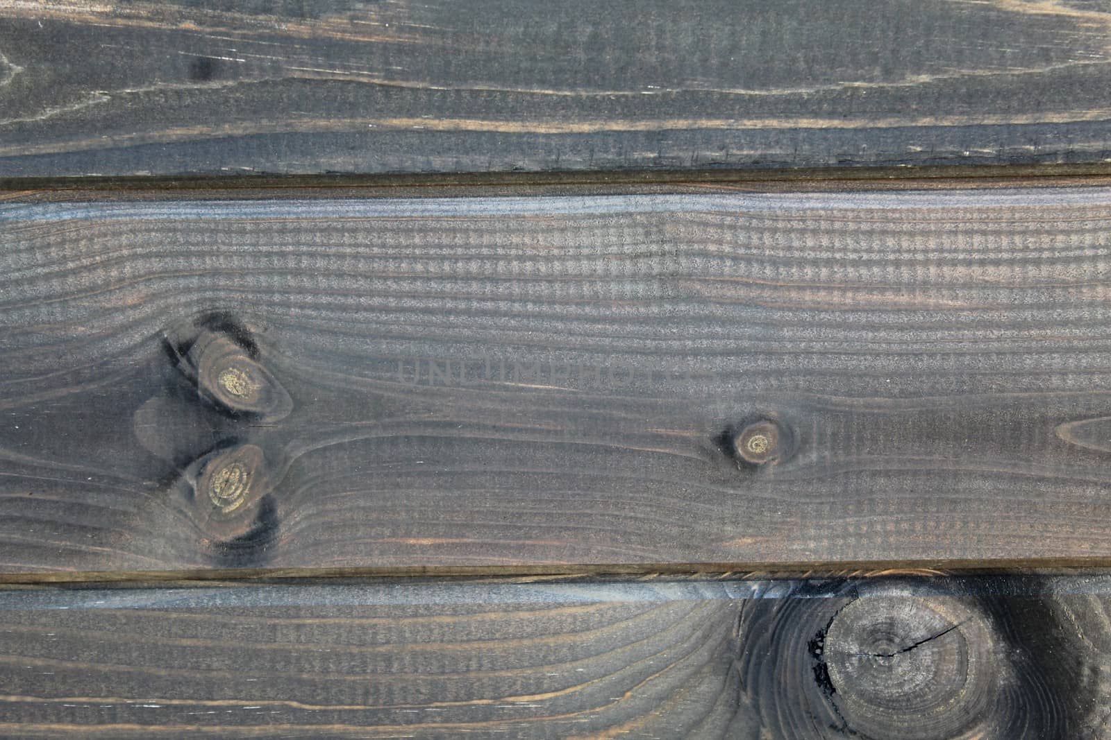 The picture shows a background with brown wooden boards