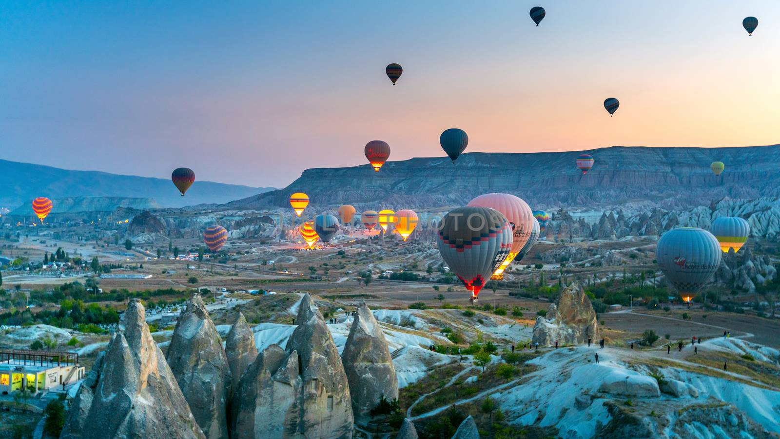 Colorful hot air balloon flying over Cappadocia, Turkey.