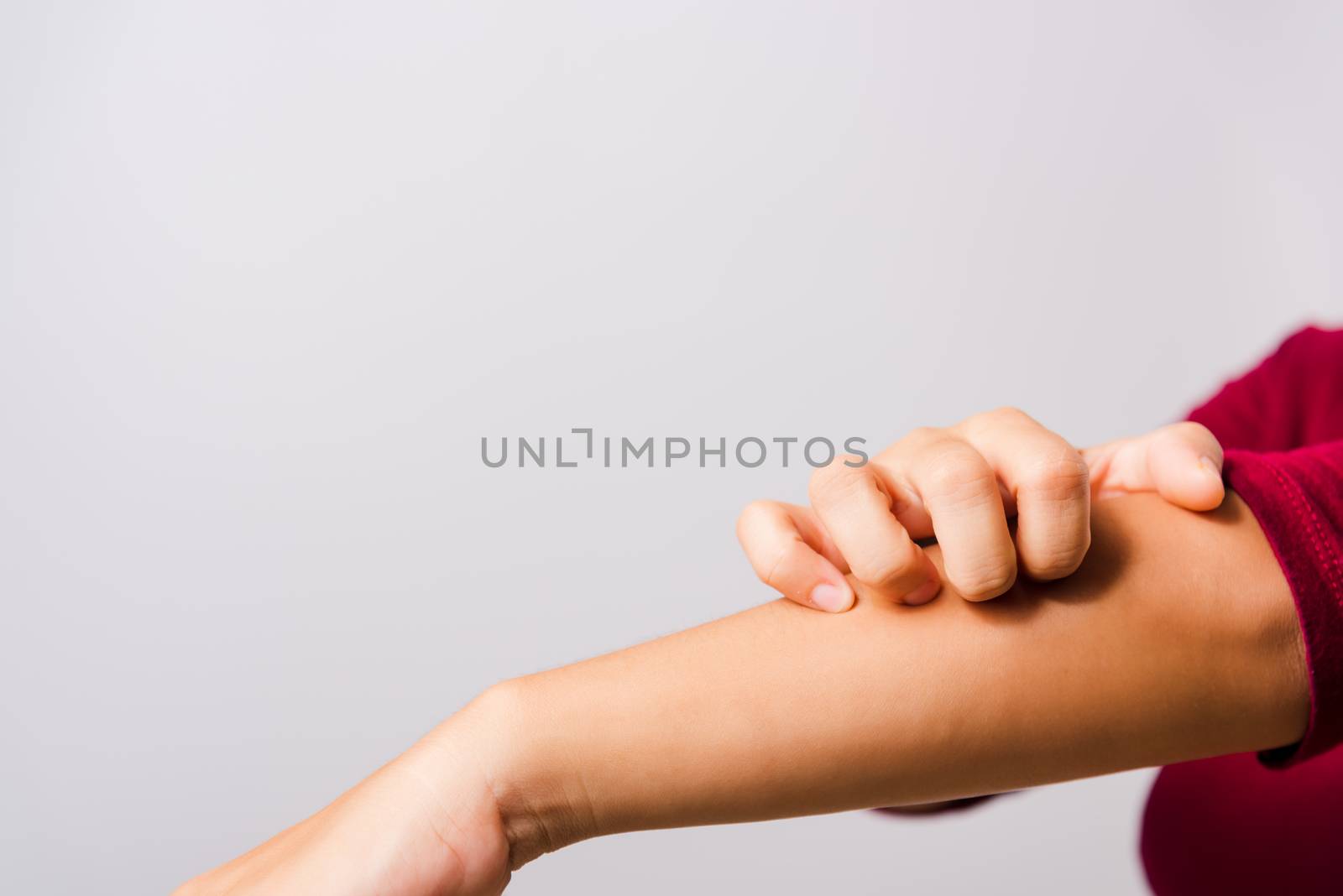 Asian beautiful woman itching her scratching her itchy arm on white background with copy space, Medical and Healthcare concept