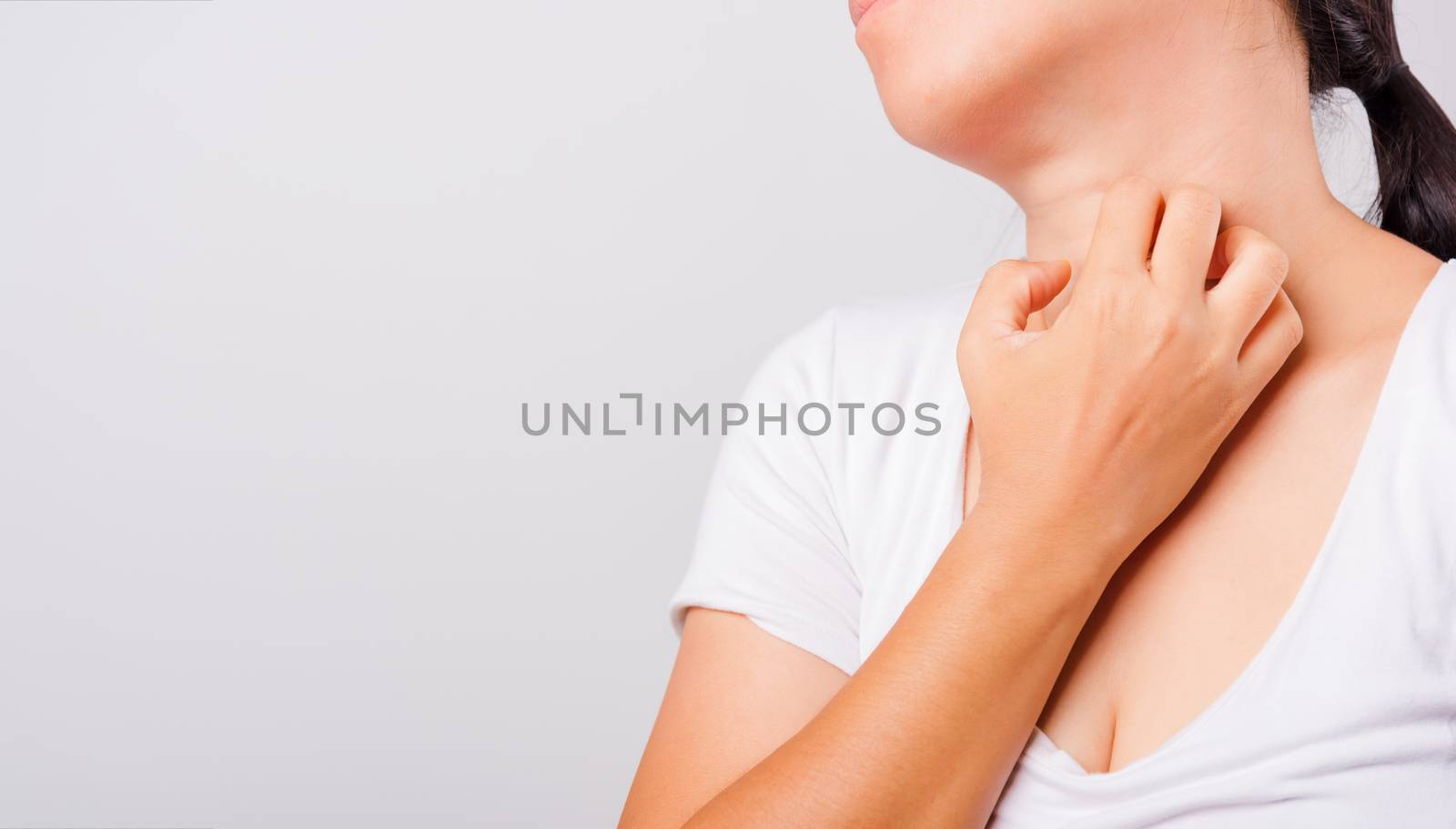 Asian beautiful woman itching her useing hand scratch itch neck on white background with copy space, Medical and Healthcare concept