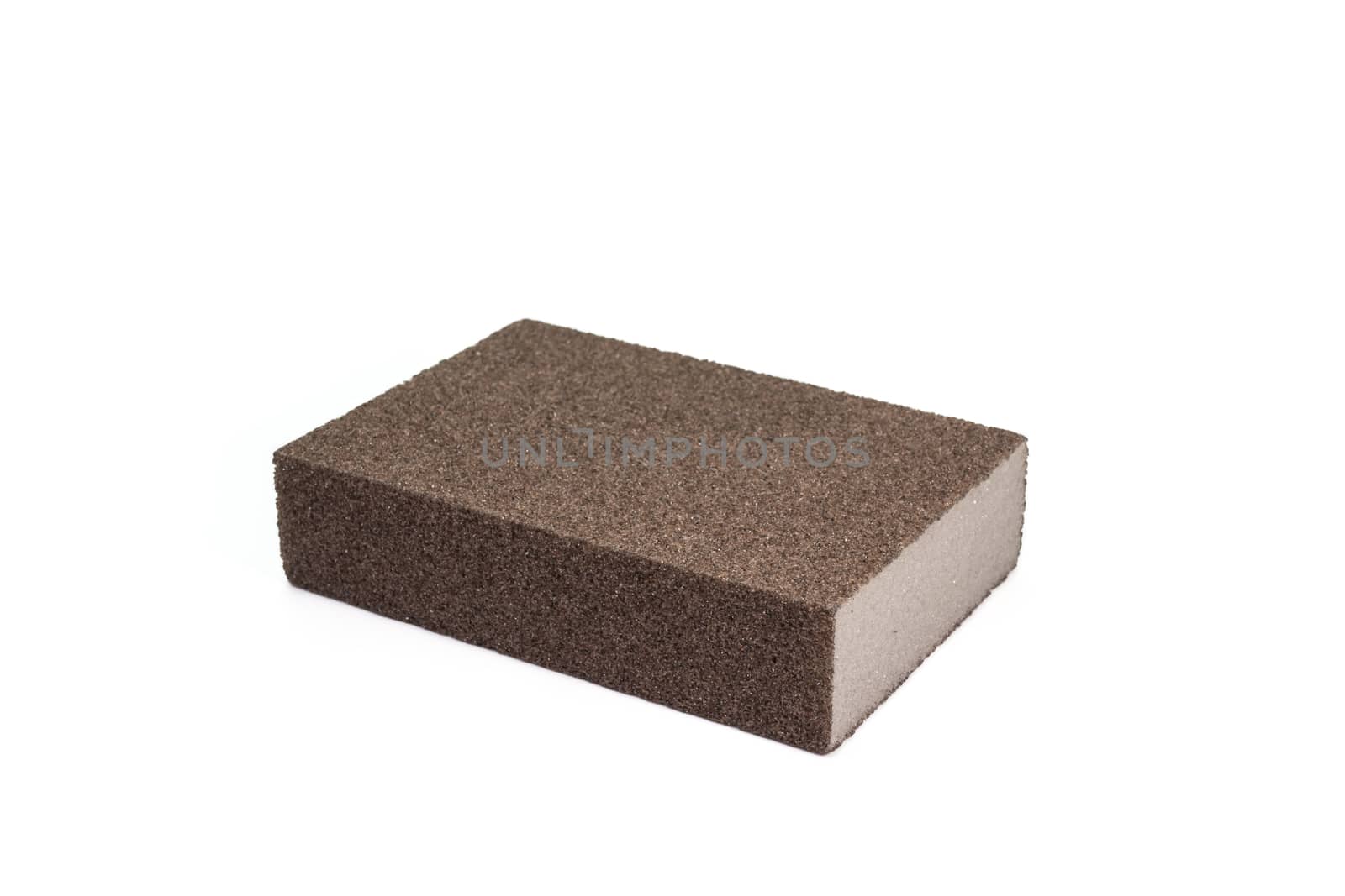 The close up of polishing sandpaper rough sponge block for kitchenware cleaning.