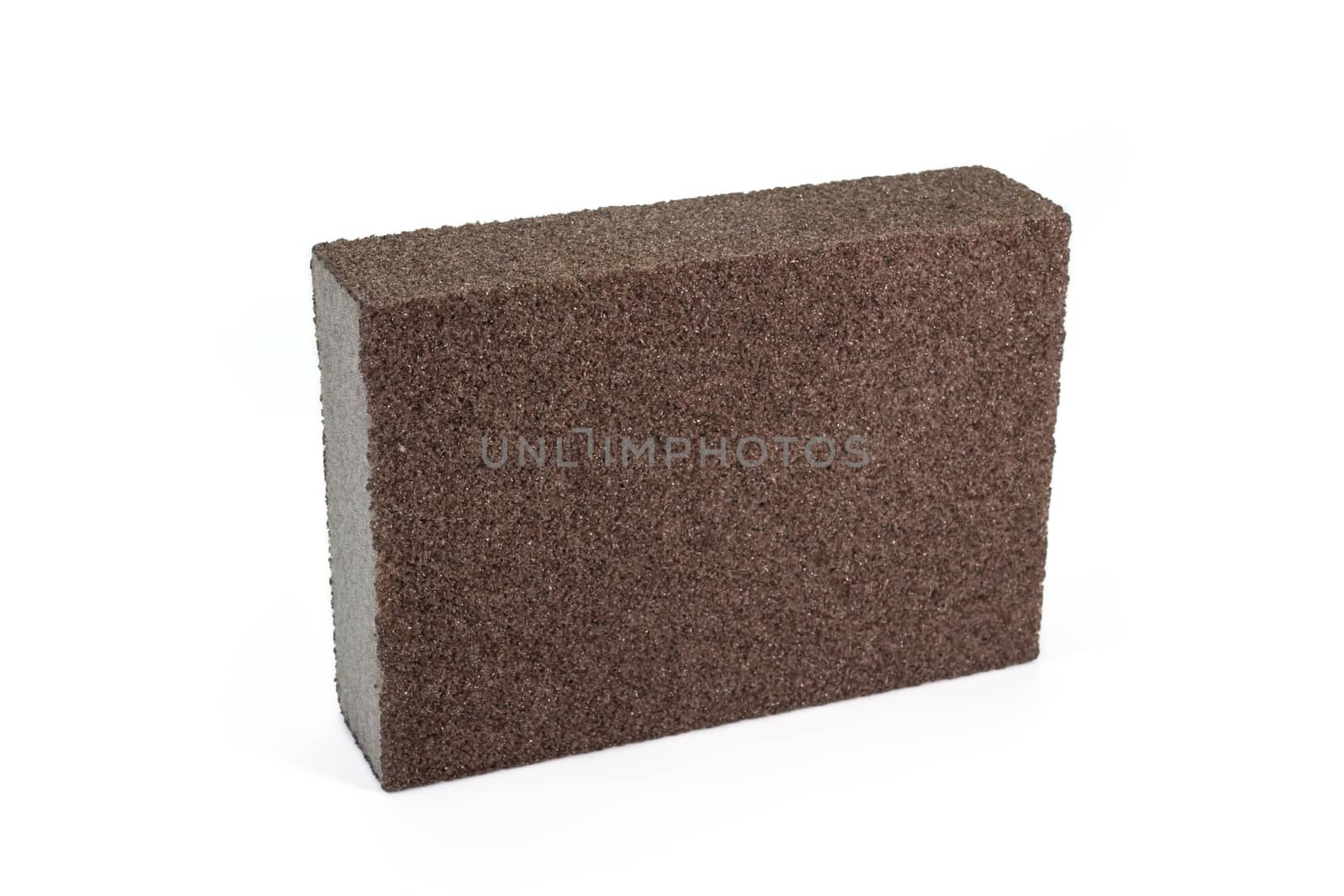 The close up of polishing sandpaper rough sponge block for kitchenware cleaning.