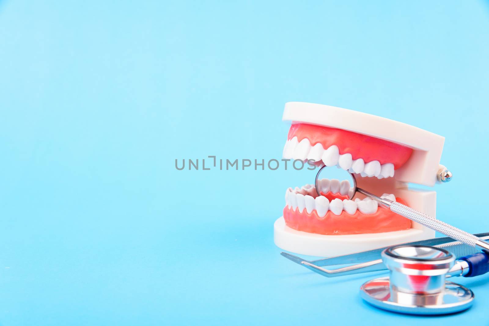Dental Hygiene Health Concept, White tooth and Dentist tools for by Sorapop