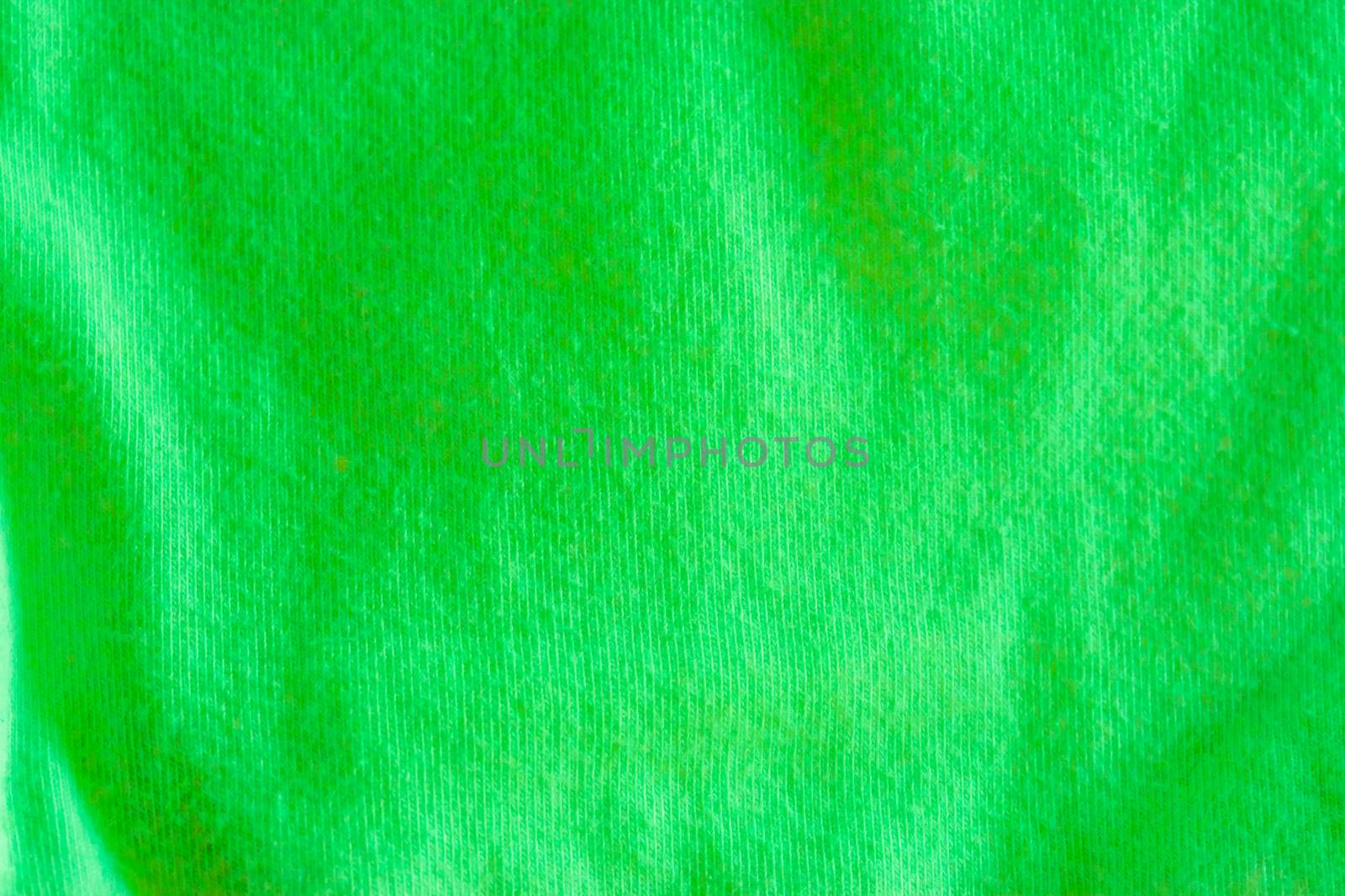 Modern apple green cotton fabric in macro closeup, popular material for clothes