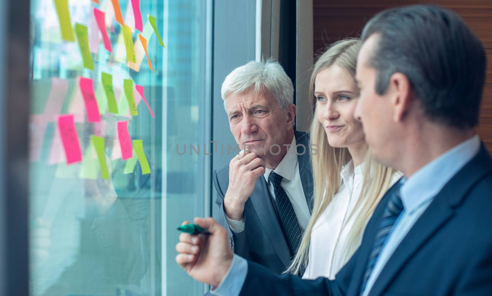 Business people brainstorming ideas. Entrepreneurs having a standing meeting discussing ideas strategy planning problem solution concept