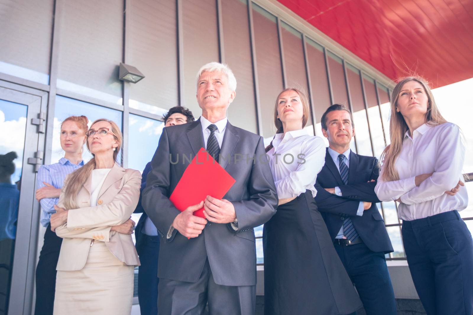 Successful Business People Standing Together and Looking at Their Bright Future