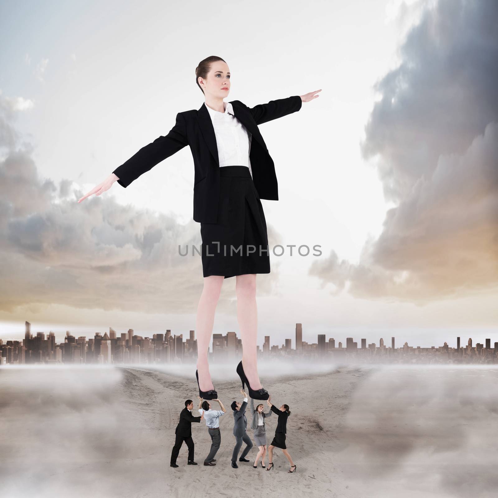Composite image of business team supporting boss by Wavebreakmedia