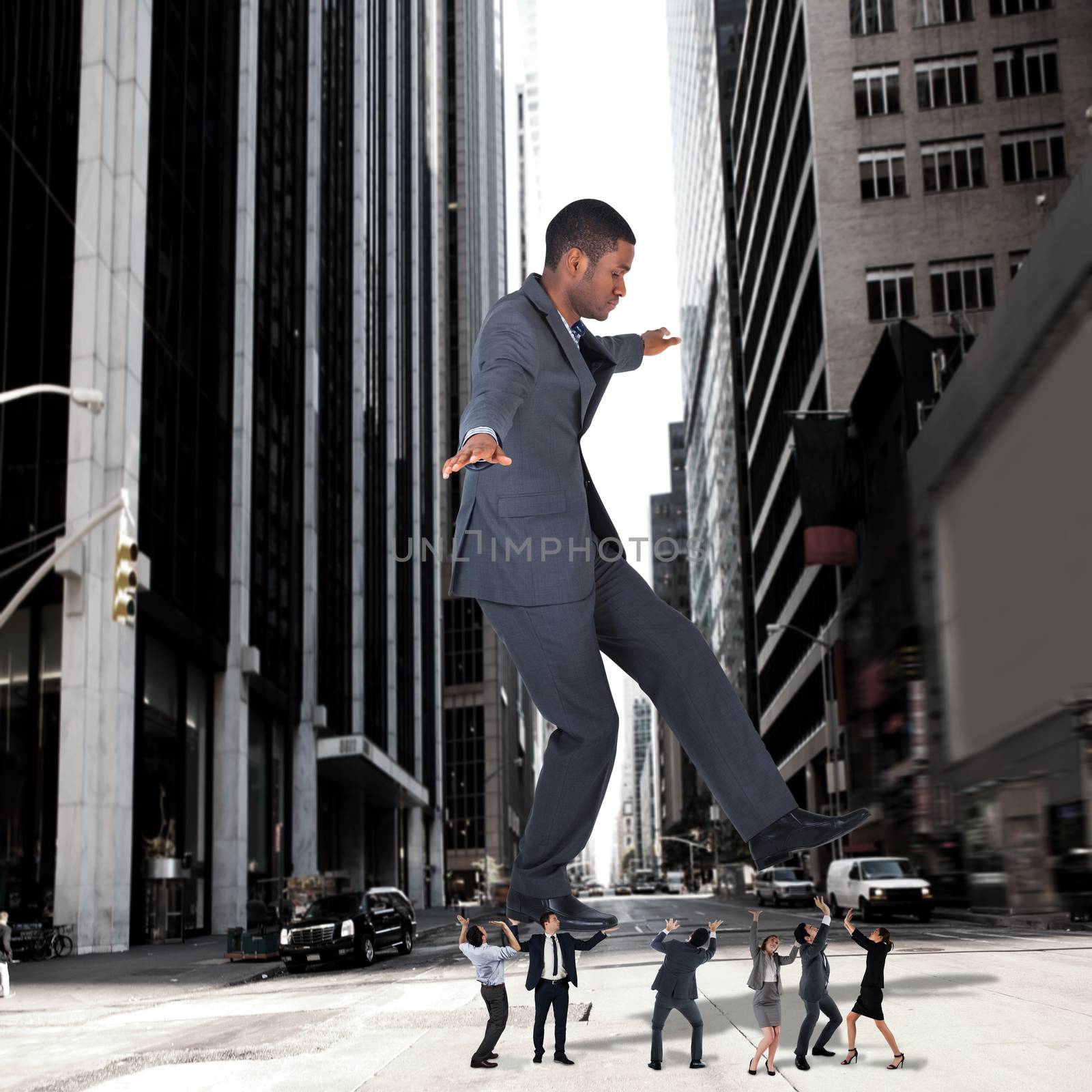 Composite image of business team supporting boss against new york street