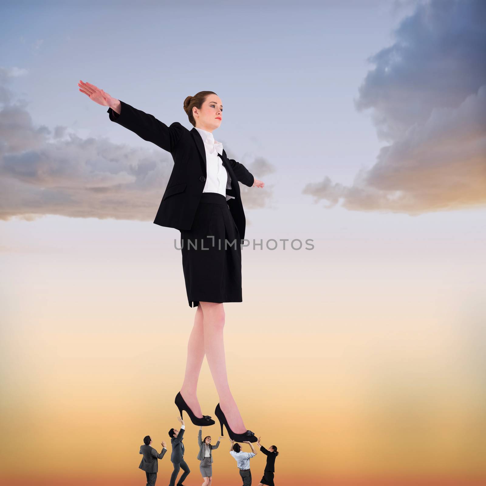 Composite image of business team supporting boss by Wavebreakmedia