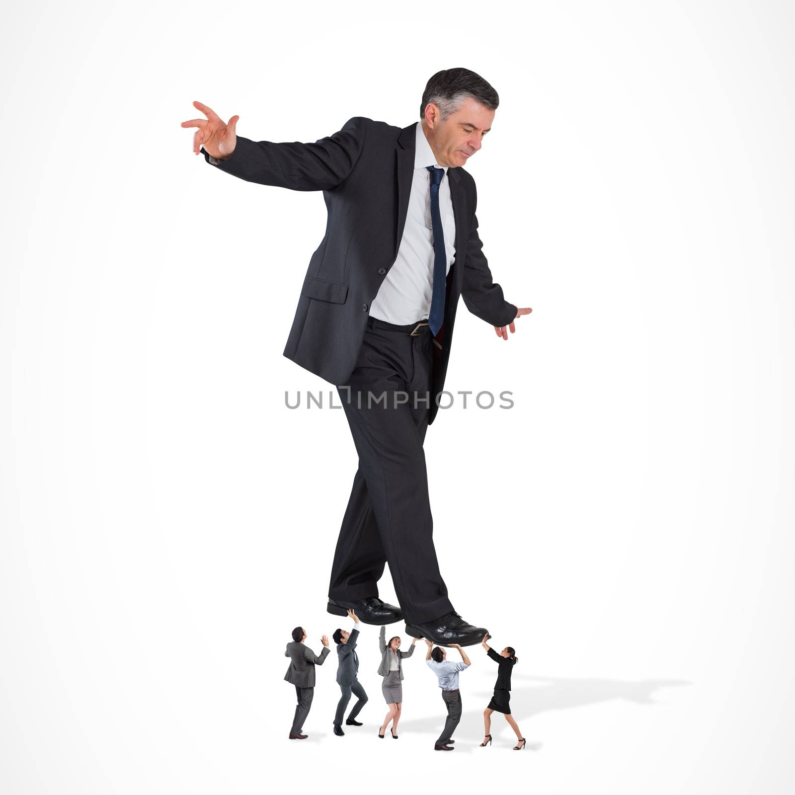 Composite image of business team supporting boss by Wavebreakmedia