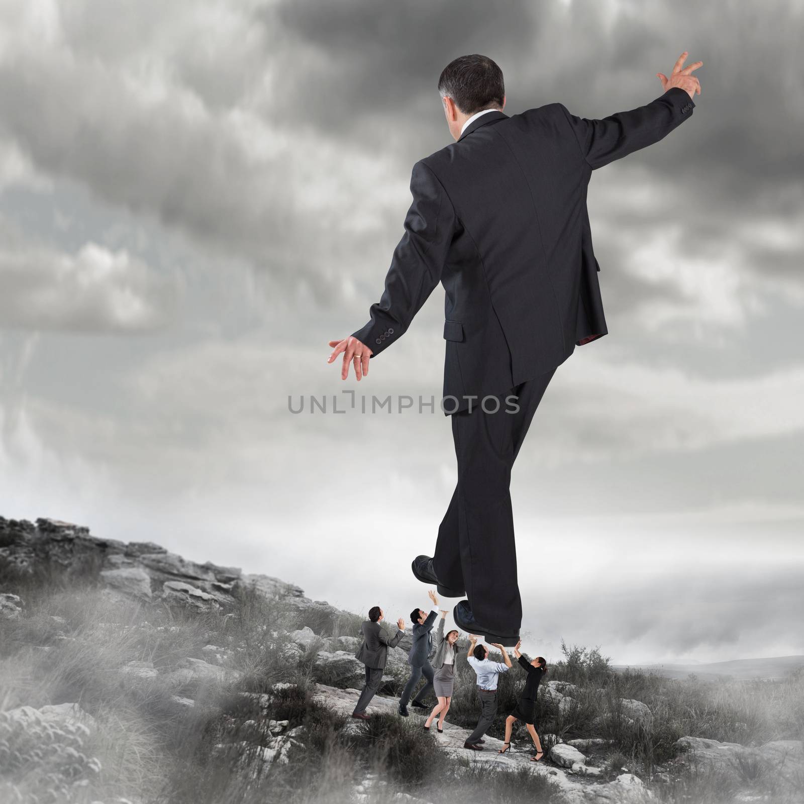 Composite image of business team supporting boss by Wavebreakmedia