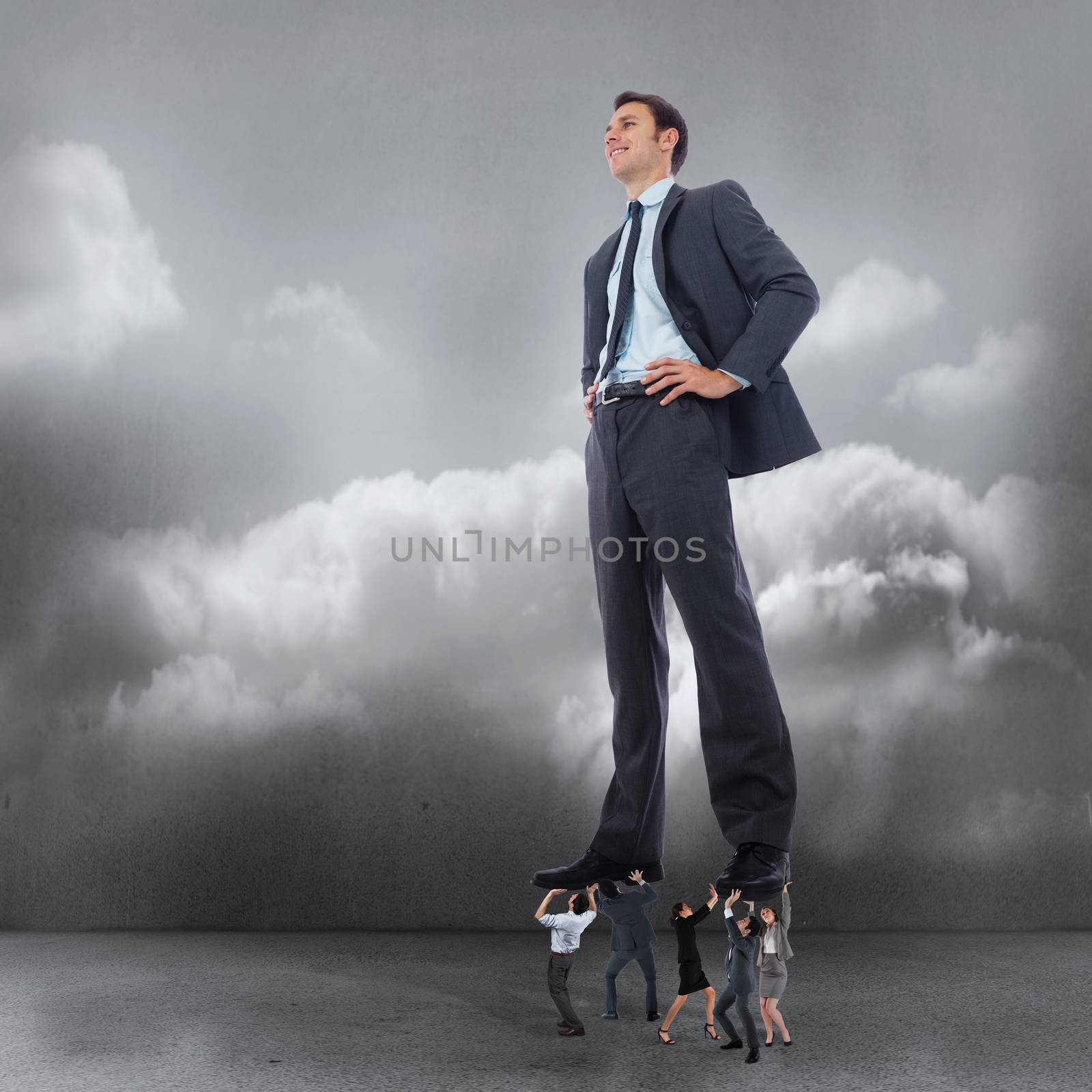 Composite image of business team supporting boss against clouds in a room