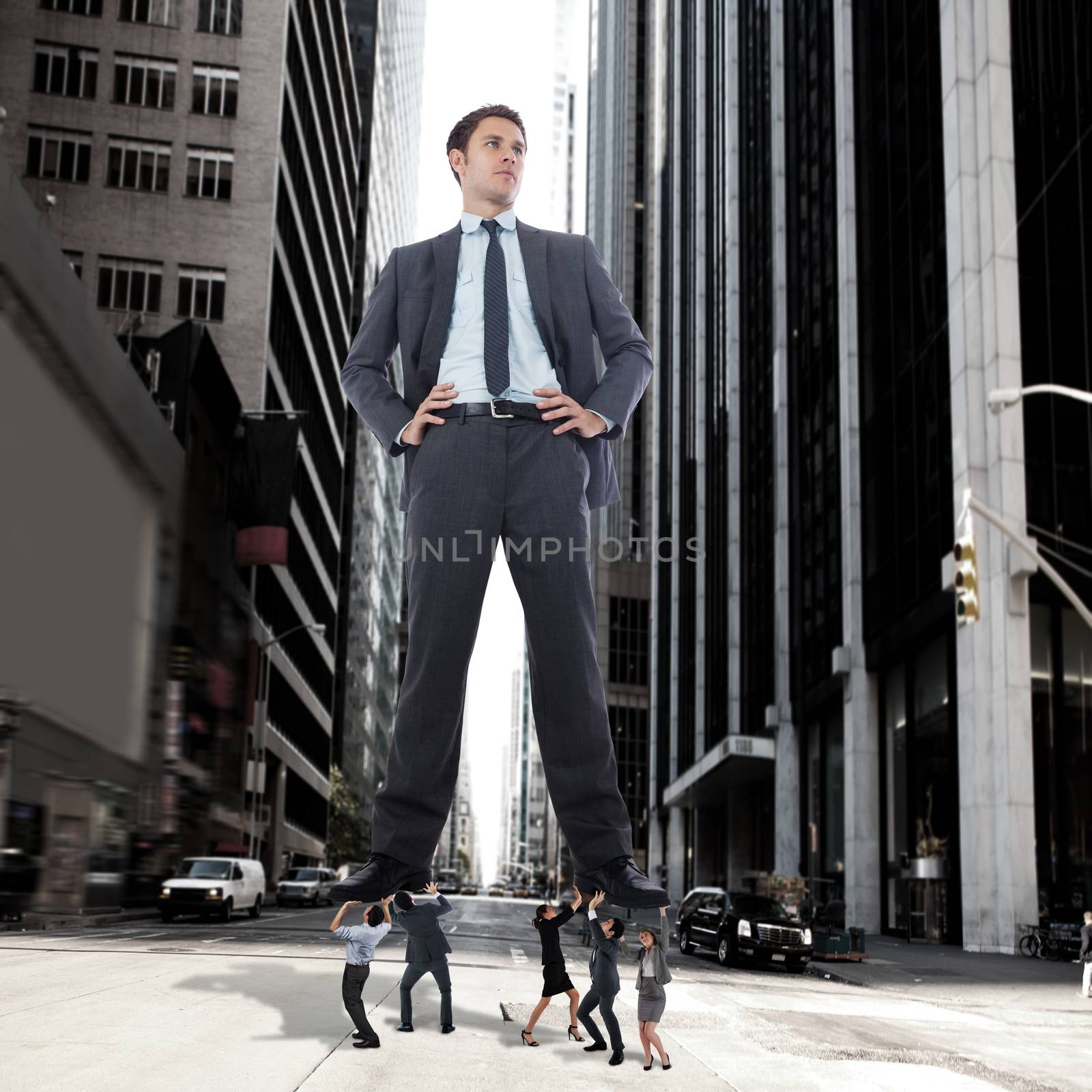 Composite image of business team supporting boss by Wavebreakmedia