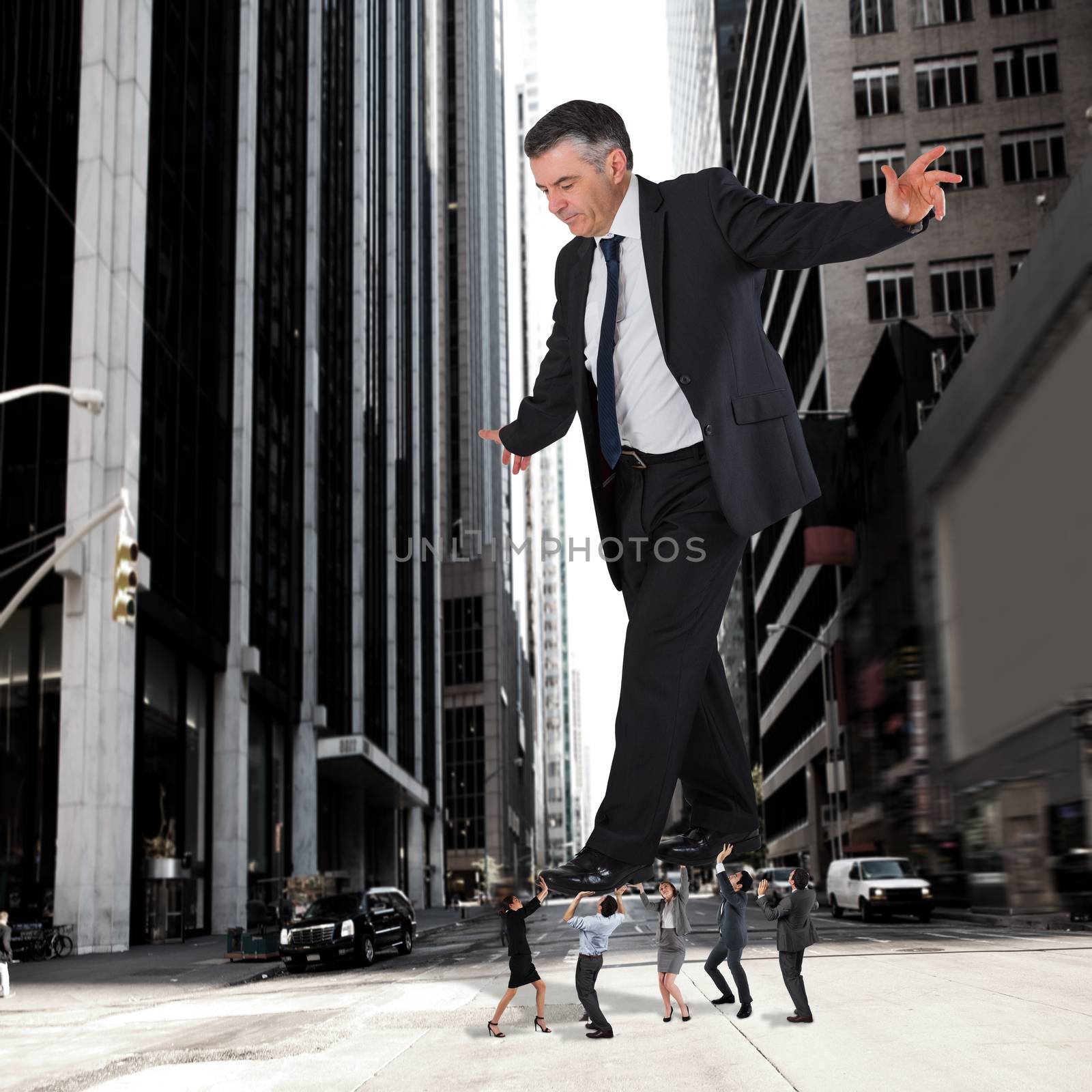 Composite image of business team supporting boss against new york street