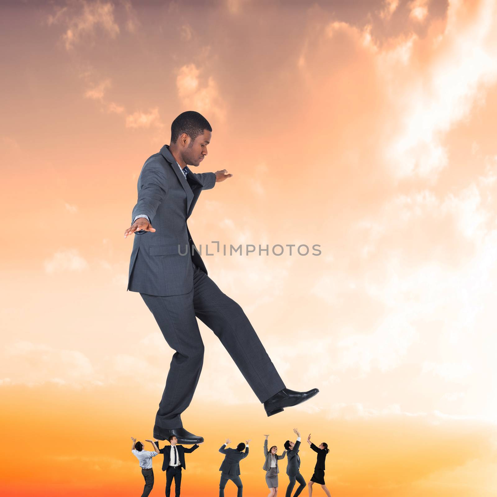 Composite image of business team supporting boss by Wavebreakmedia