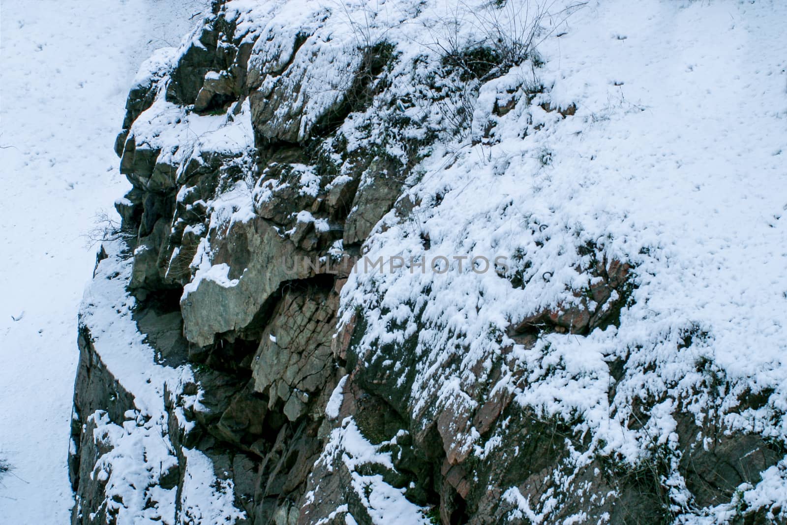 Hillside of a mountain in winter seasonal landscape in a winter frosty weather.