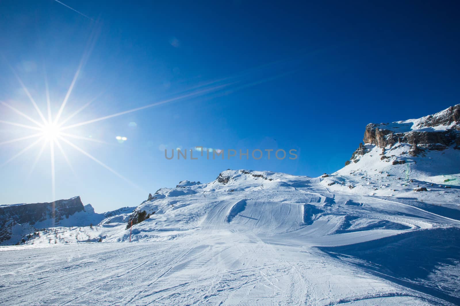 Dolomities Dolomiti Italy in wintertime beautiful alps winter mountains and ski slope Cortina d'Ampezzo Cinque torri mountain peaks famous landscape skiing resort area